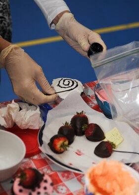 MINOT AIR FORCE BASE, N.D. – In dedication to National Domestic Violence Awareness month and the safety security forces members provide to the base, cupcakes were decorated and distributed to the four security forces squadrons here at Minot AFB. A decorating competition was also held to bring in additional volunteers. The first place winner created a cupcake in the image of a hamburger. (U.S. Air Force photo/Senior Airman Ashley N. Avecilla)