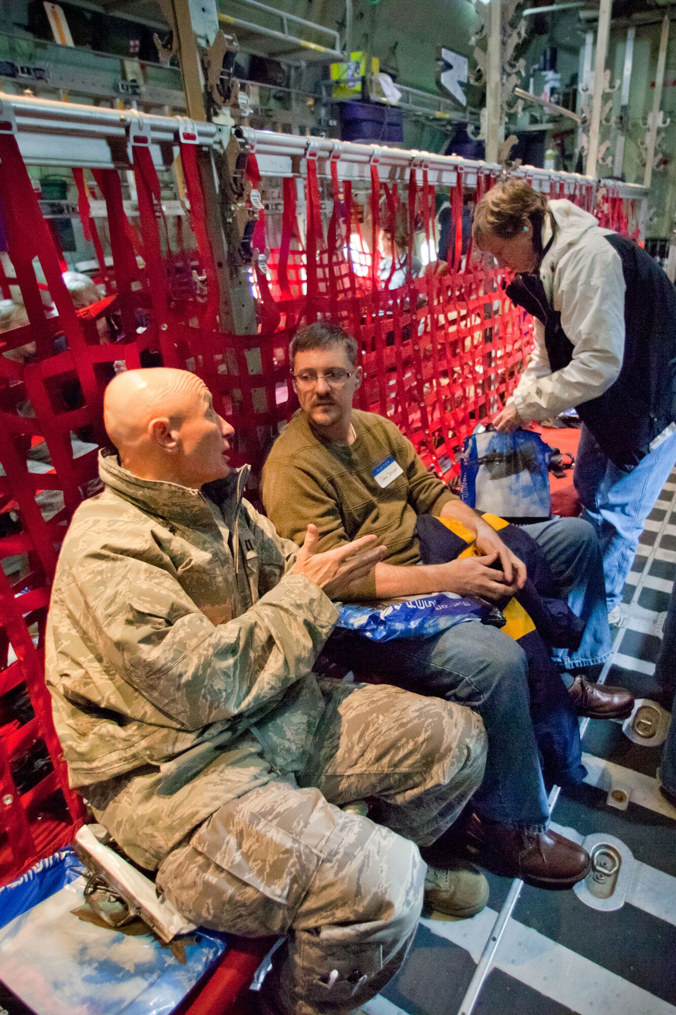 Chaplain (Capt.) Larry Blake and John Steiner talk durning the beginning of the flight. (Air Force Photo/Shannon McKay)