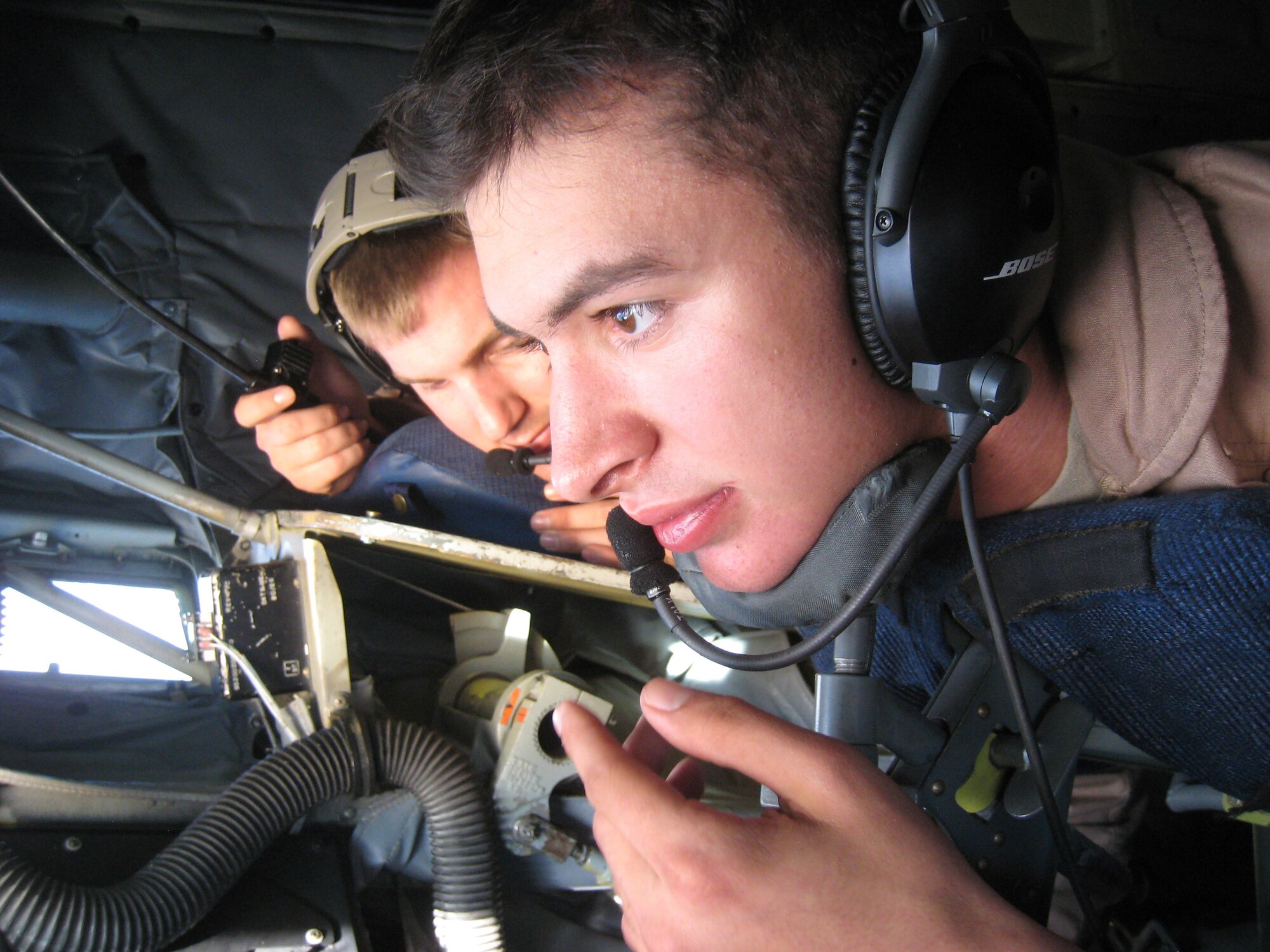 Airman 1st Class James Shaffer (right), KC-135 Stratotanker boom operator deployed to the 313th Air Expeditionary Wing in the European theater of operations, prepares to refuel F-16 Fighting Falcons on Oct. 31, 2011, over the Mediterranean Sea on their final no-fly zone mission of the NATO-led operation. A United Nations mandate to protect civilians in Libya resulted in a coalition of 28 countries providing air and maritime intridiction. This was Shaffer's first operational deployment. (U.S. Air Force Photo/Maj. Andra Higgs)