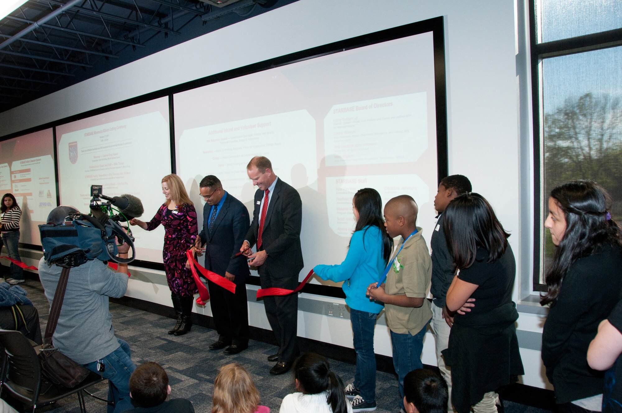 STARBASE launches a new era in education with a ribbon cutting ceremony on Oct. 17, 2011 at the 133rd Airlift Wing base at the Minneapolis - St. Paul international airport. Rep. Keith Ellison (center) is joined by students, staff and supporters. USAF official photo by Senior Airman Jonathan Young
