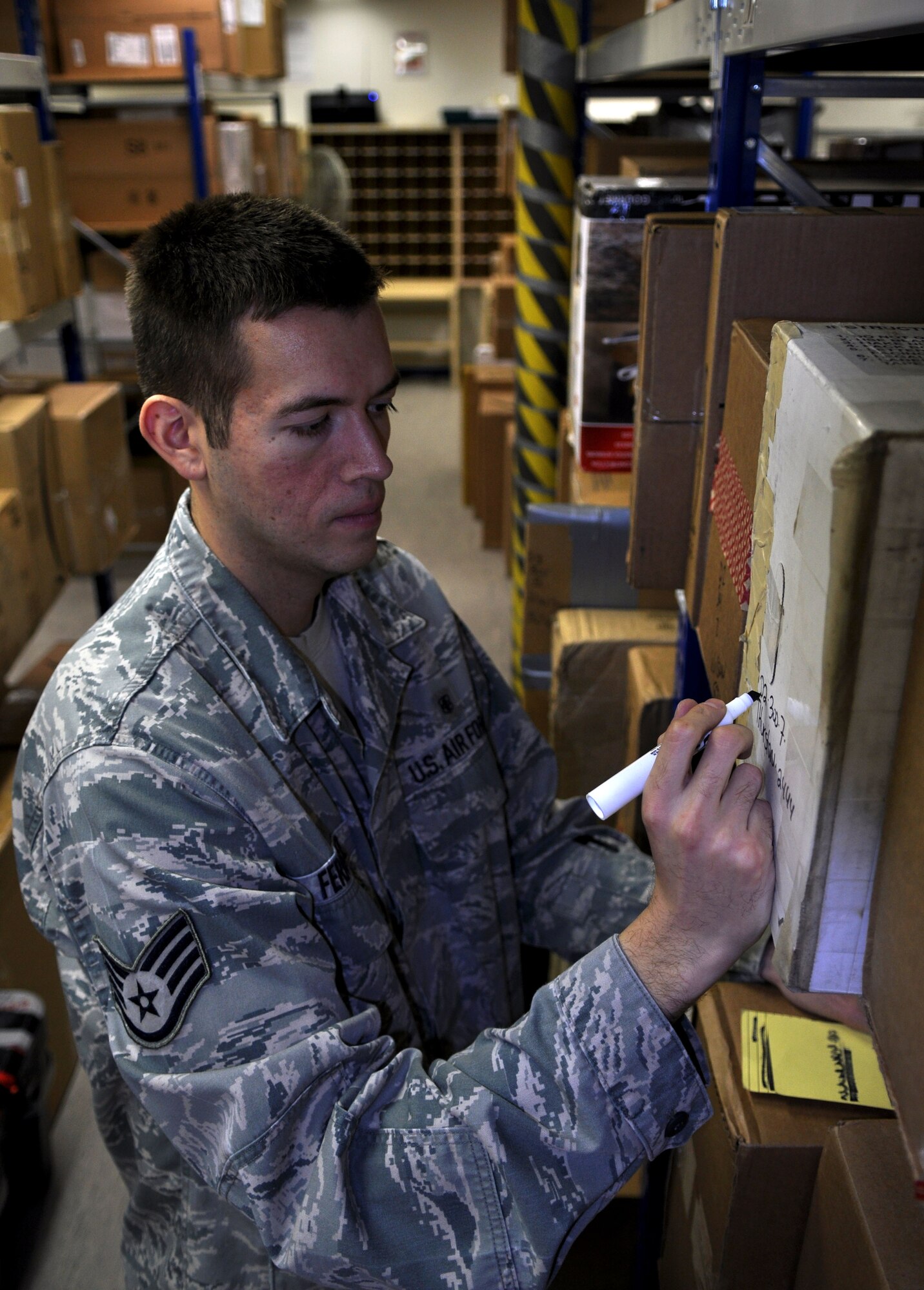 SPANGDAHLEM AIR BASE, Germany -- Staff Sgt. Robert Fernandez, 52nd Communications Squadron postal service clerk, writes a box number on a package sent to the post office here Oct. 31. With high postal traffic expected during the holidays, the Military Postal Service Agency has issued a list of cut-off dates to get packages sent out on time. Packages being sent from the states to any APO, FPO and DPO address must be sent by the following dates to arrive in time for Christmas: The express mailing date is Dec. 17, first class and priority mailing dates are Dec. 3 for contingency locations and Dec. 10 for all others; PAL parcel dates are Dec. 1 for contingency locations and Dec. 3 for all others; SAM parcel dates are Nov. 26 and parcel post dates are Nov. 12. Mail being sent to APO/FPO and DPO addresses must include the receiving persons full name, unit, PSC and box numbers, APO/ FPO or DPO location and zip code. Packages sent to overseas military addresses will not be received if the base and country is listed on the parcel. For more information, visit http://hqdainet.army.mil/mpsa/xmas.htm. (U.S. Air Force photo/Senior Airman Natasha Stannard)
