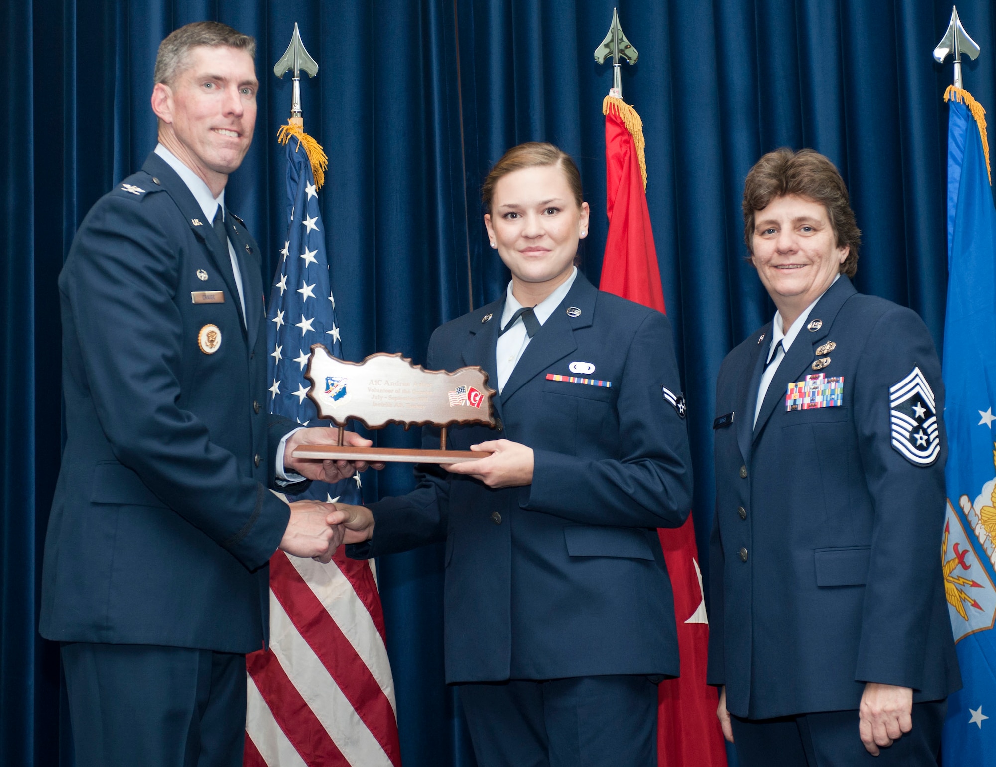 Airman 1st Class Andrea Adler, 39th Logistic Readiness Squadron, receives the Volunteer of the Quarter Award Oct. 31, 2011, in the Club Complex ballroom at Incirlik Air Base, Turkey.(U.S. Air Force photo by Senior Airman Clayton Lenhardt/Released)