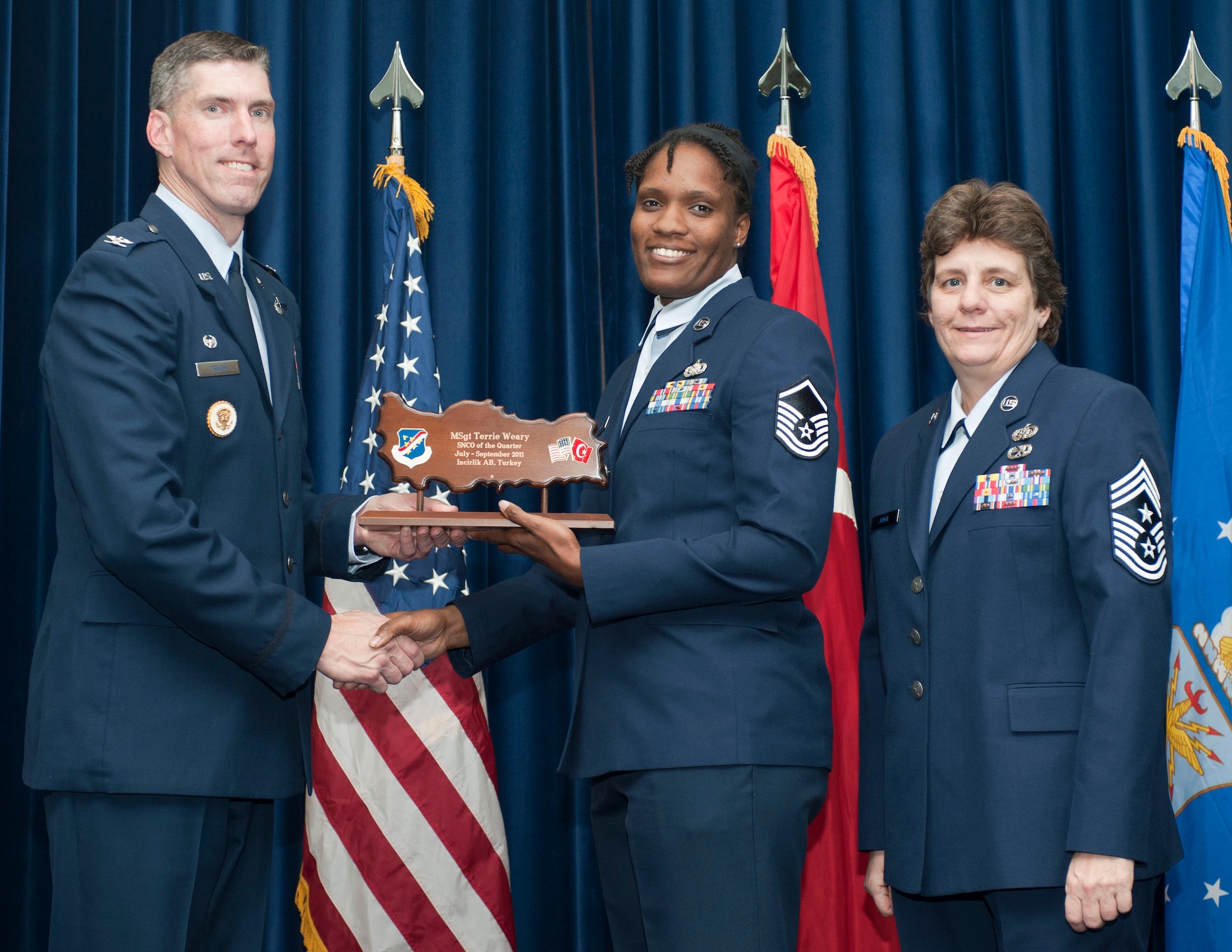 Master Sgt. Terrie Weary, 39th Logistics Readiness Squadron, receives the wing-level Senior NCO of the Quarter Award Oct. 31, 2011, in the Club Complex ballroom at Incirlik Air Base, Turkey.(U.S. Air Force photo by Senior Airman Clayton Lenhardt/Released)