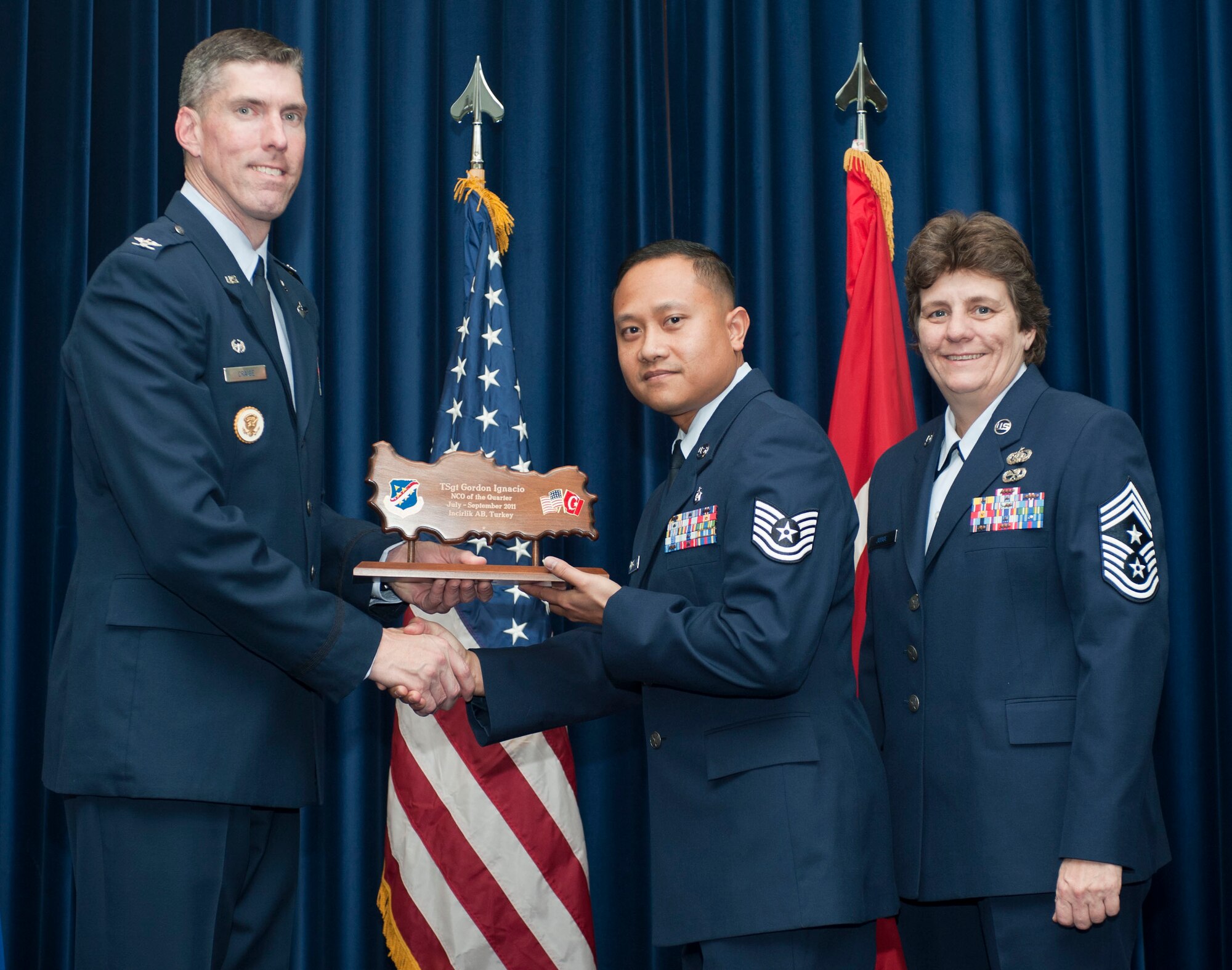 Tech. Sgt. Gordon Ignacio, 39th Medical Support Squadron, receives the wing-level NCO of the Quarter Award Oct. 31, 2011, in the Club Complex ballroom at Incirlik Air Base, Turkey.(U.S. Air Force photo by Senior Airman Clayton Lenhardt/Released)