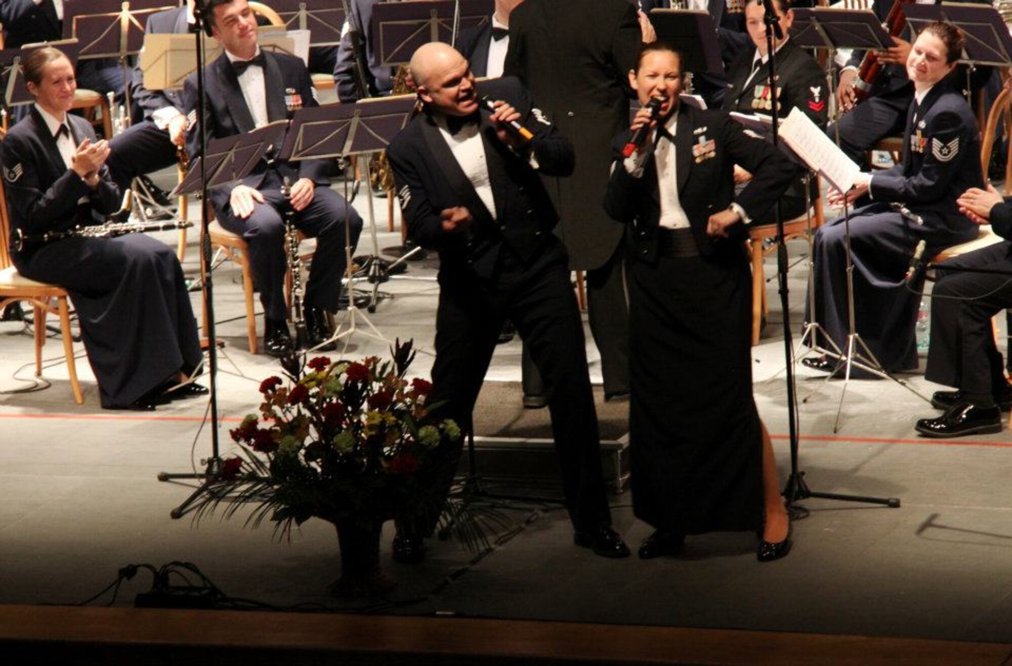 Staff Sgt. Rachel Trimble and Staff Sgt. Kevin Keenom, vocalists with the U.S. Air Forces in Europe Band, get the audience swinging at the Philharmonic Hall in Perm, the Russian Federation Oct. 25, 2011. The USAFE Band was on a 8-day tour of the Western Siberia/Ural region as part of the "American Seasons" bilateral initiative sponsored in part by the U.S. Consulate in Yekaterinburg. (Courtesy photo)