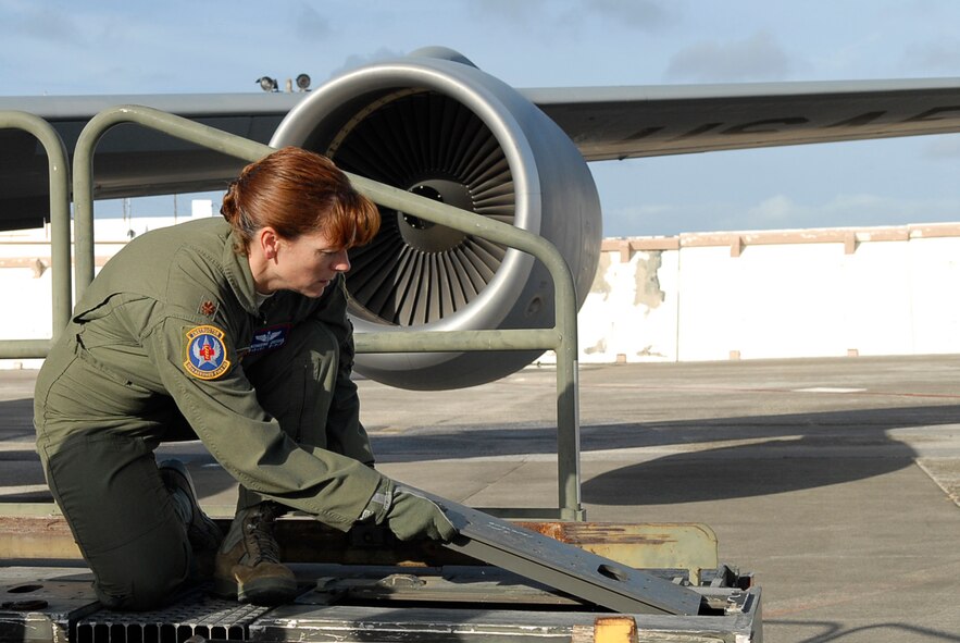 U.S. Air Force Maj. Catherine Ortega, 18th Aeromedical Evacuation Squadron officer in charge of aircrew training, switches K-loader panels to prepare for loading medical equipment for a mission at Kadena Air Base, Japan, Nov. 2. The major recently received the Dolly Vinsant Flight Nurse of the Year Award for operations during her deployment to Kandahar, Afghanistan. (U.S. Air Force photo/Airman 1st Class Tara A. Williamson/released)