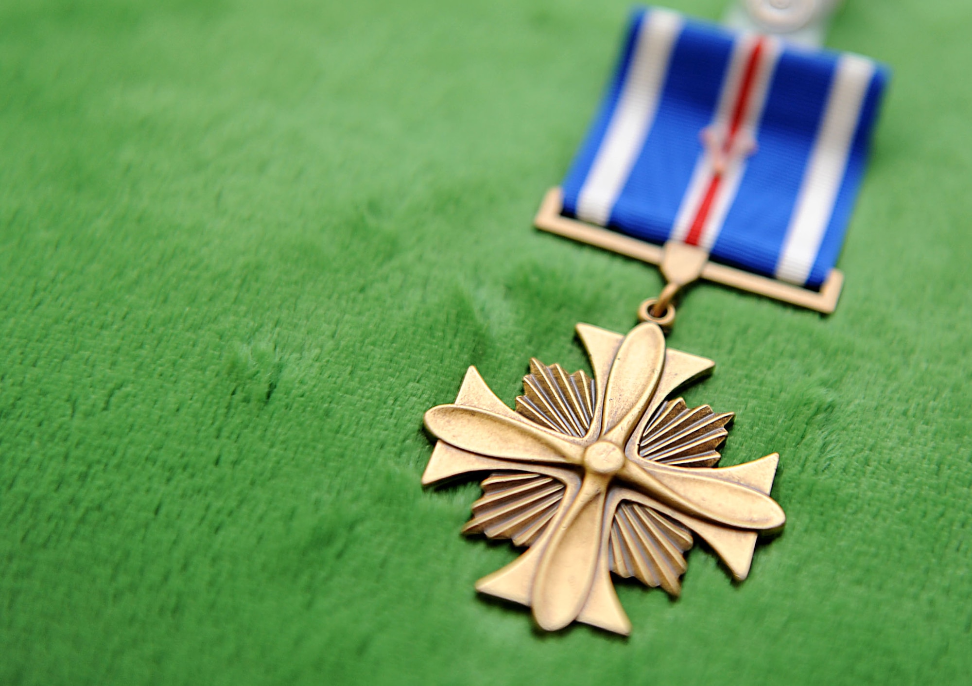 A Distinguished Flying Cross is displayed on a pillow during award ceremony for U.S. Air Force Tech. Sgt. Scott Lagerveld, 33rd Rescue Squadron flight engineer, on Kadena Air Base, Japan, Oct. 17. The Distinguished Flying Cross is awarded for heroism or extraordinary achievement while participating in aerial flight. (U.S. Air Force photo/ Airman 1st Class Brooke P. Beers/Released)