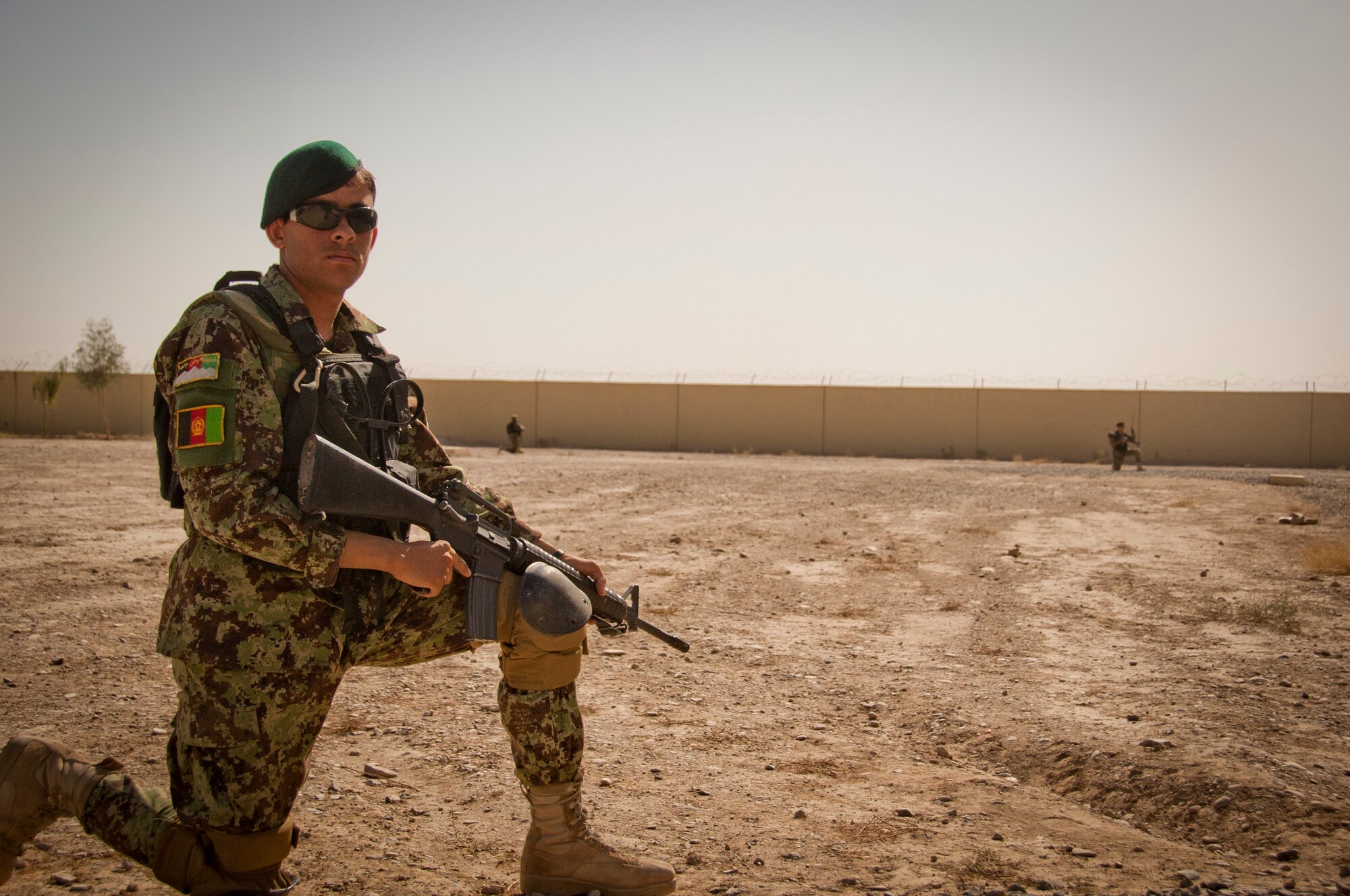 An Afghan Air Force security forces member provides perimeter security at the scene of a mass casualty exercise held at the 738th Air Expeditionary Advisory Group at Kandahar Air Wing, Kandahar, Afghanistan Oct. 31, 2011. The airmen practiced their emergency response procedures during the scenario which included a simulated vehicle born improvised explosive device explosion. Officials said the goal of the exercise was to test Afghan and 738th AEAG response and observe their ability to react and support the staged disaster. (U.S. Air Force photo by Senior Airman Corey Hook)