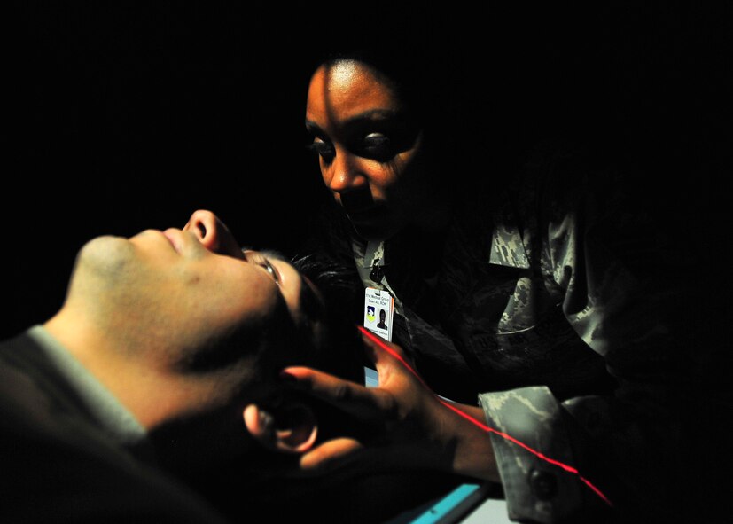 Staff Sgt.  Antionette Sherman, 51st Medical Operations Squadron radiology technician, positions a patient’s skull Nov. 1, 2011. The positioning of the skull is vital in diagnosing abnormities in the skull. (U.S. Air Force photos/Senior Airman Adam Grant)