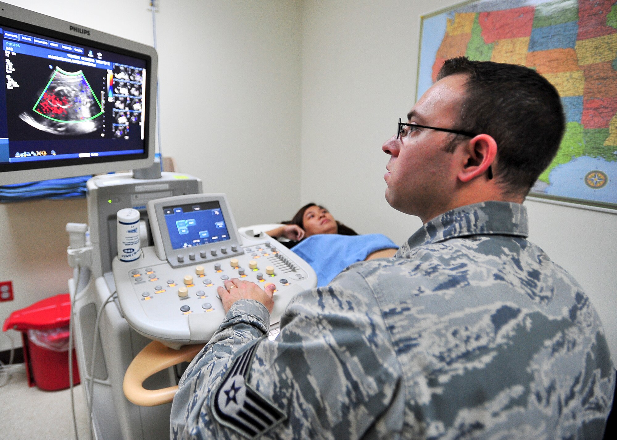 Staff Sgt.  Benjamin Zamora, 51st Medical Operations Squadron radiology technician, tells a patient the results of her pelvic ultra sound exam Nov. 1, 2011. The exam is used to diagnose the baby’s health and progression. (U.S. Air Force photo/Senior Airman Adam Grant)