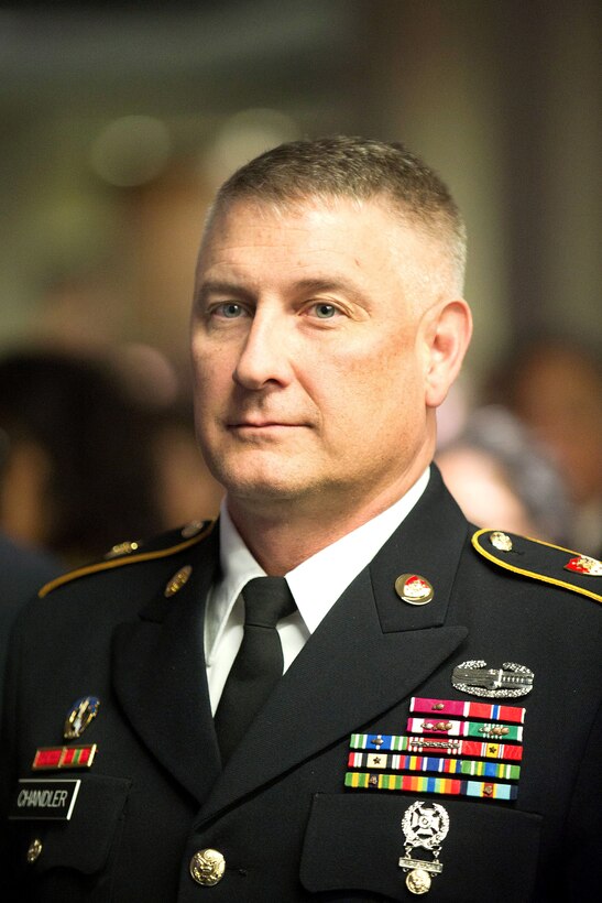 The Sgt. Maj. of the Army Raymond F. Chandler III attends the World War II Nisei Veterans Program National Veterans Network tribute to the 100th Infantry Battalion, 442nd Regimental Combat Team and Military Intelligence Service in Washington, D.C., Nov. 1, 2011.