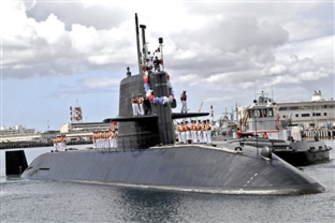 Japan Maritime Self-Defense Force Oyashio class submarine JS Mochishio arrives on Joint Base Pearl Harbor-Hickam, Hawaii, Oct. 31, 2011. Mochishio will be conducting both in-port and at-sea training on undersea tactics, anti-submarine warfare and war time strategies.