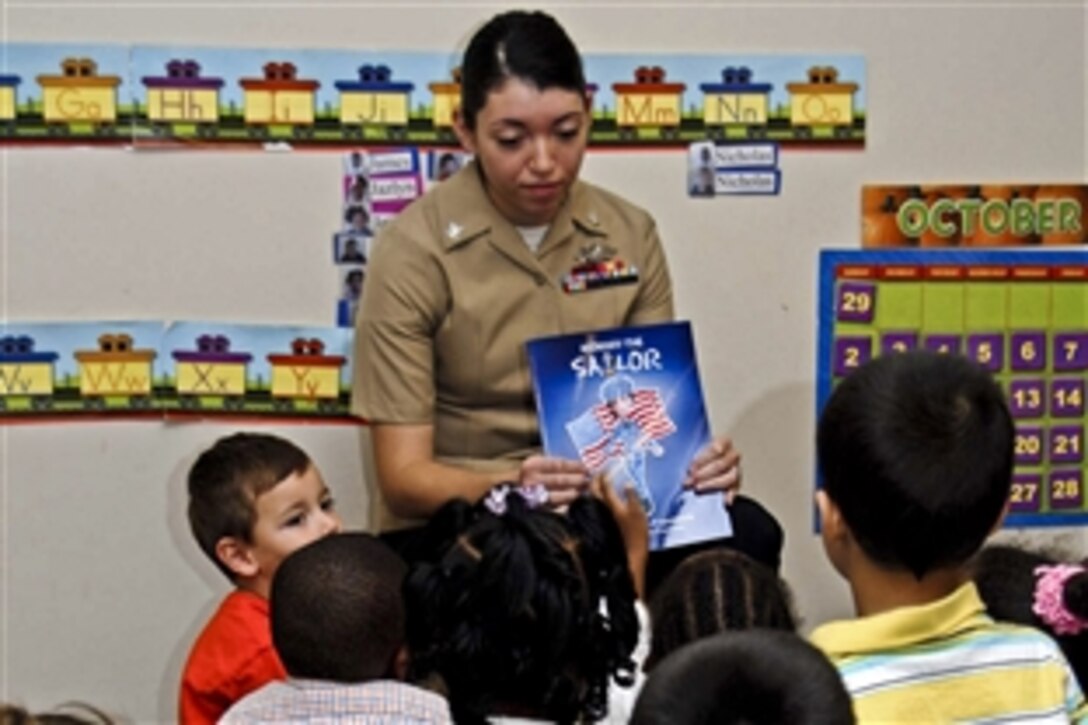 U.S. Navy Petty Officer 3rd Class Angelina Colon-Franceschi reads "Mommy the Sailor" to children at the Willoughby Child Development Center in Norfolk, Va., Oct. 28, 2011. Colon-Franceschi co-authored and illustrated the book, which explains a military mother's absence when it comes time for deployment. 