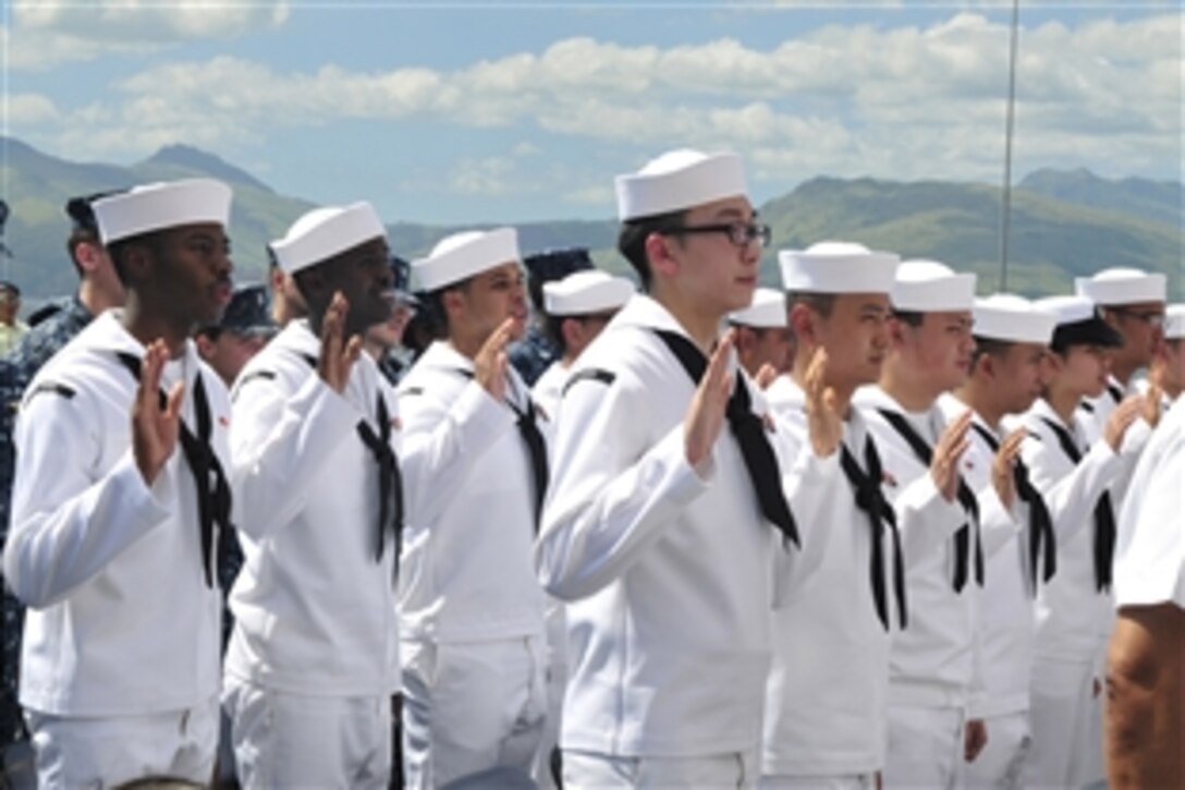 U.S. sailors take the oath of allegiance during a naturalization ceremony aboard the USS Essex in Subic Bay, Philippines, Oct. 31, 2011. Essex is part of the Essex Amphibious Ready Group and is conducting operations in the western Pacific region.