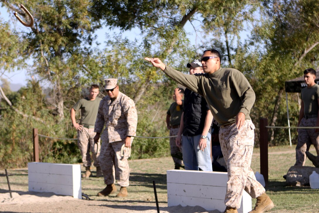 Gunnery Sgt. Omar Medina, a military policeman with Marine Wing Support Squadron 372, 3rd Marine Aircraft Wing, tosses a well-aimed horseshoe during the 2011 Pendleton Cup Horseshoe Tournament at Camp Pendleton’s Lake O’Neil, Nov. 2. The Horseshoe tournament was one of the last chances for competitors to earn points for their units.  Cash prizes will be awarded to the three units with the most earned points.