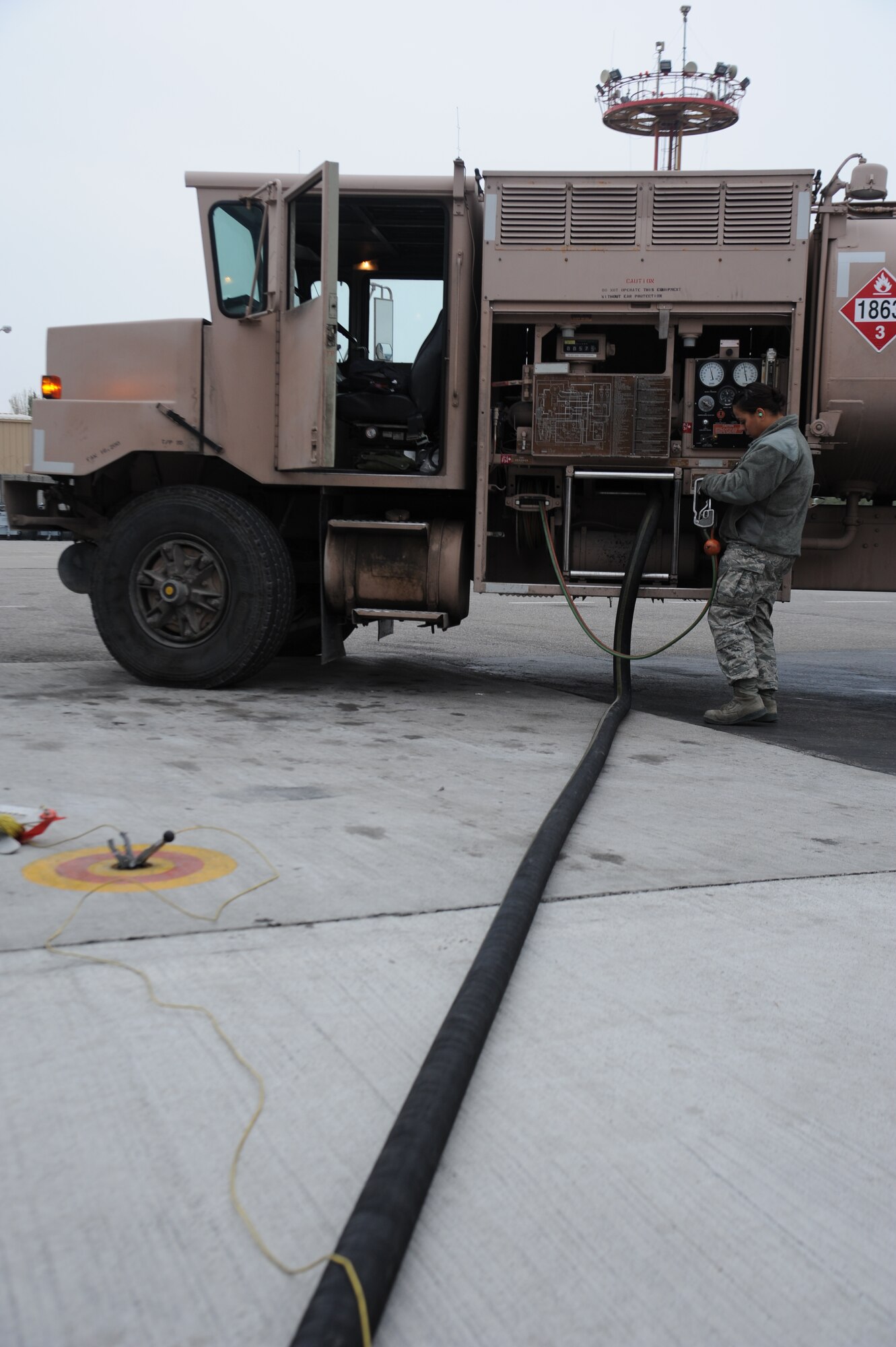 Airman 1st Class Christina Rody, 376th Expeditionary Logistics Readiness Squadron fuels specialist, records the amount of fuel delivered at the Transit Center at Manas, Kyrgyzstan, Nov. 1. The 376th ELRS fuels flight delivers an average of 13 million gallons of fuel monthly. Rody is deployed from the 2nd Logistics Readiness Squadron at Barksdale Air Force Base, La. (U.S. Air Force photo/Tech. Sgt. Hank Hoegen)