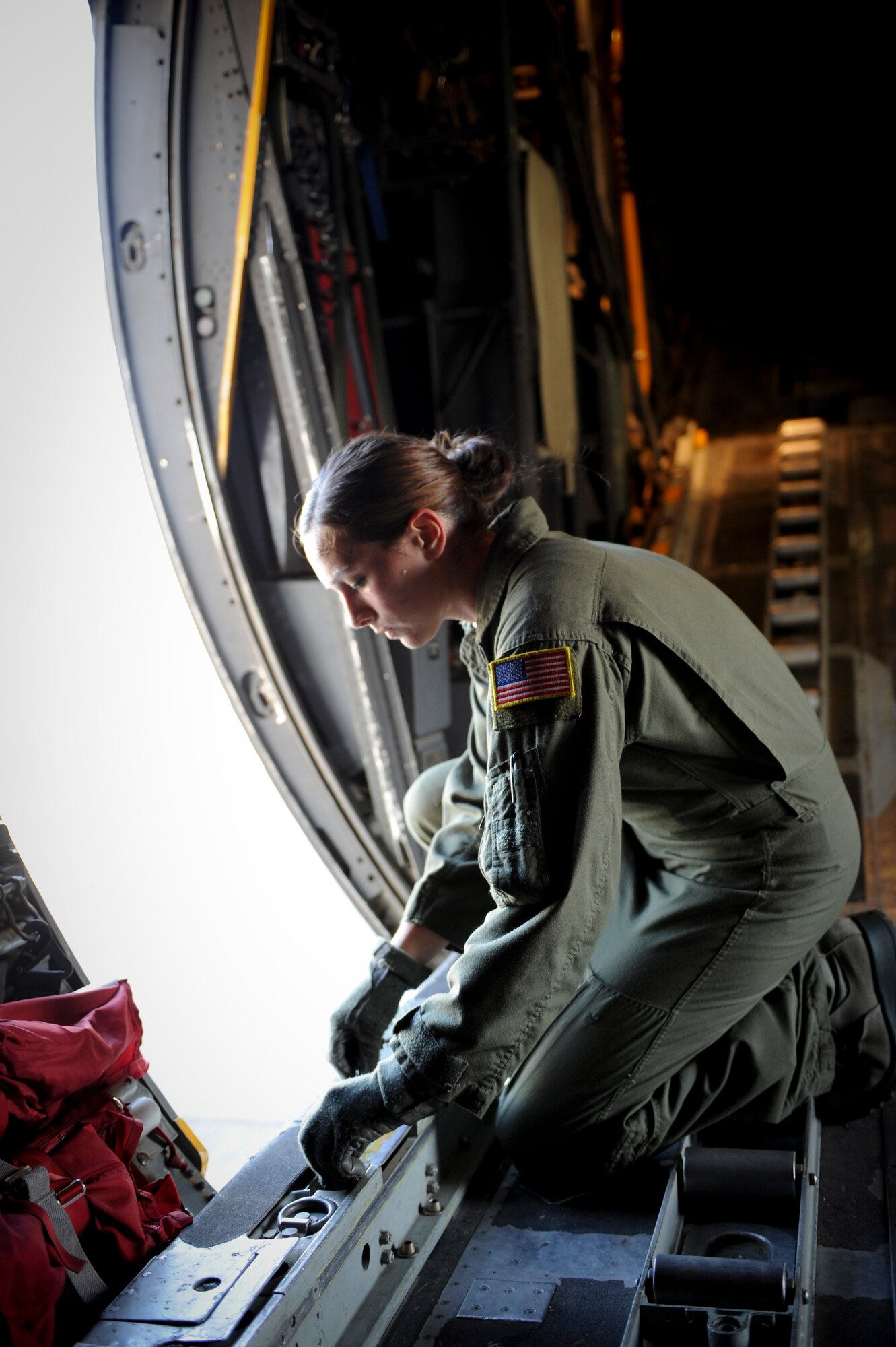 YOKOTA AIR BASE, Japan -- Senior Airman Jordanna Wilson, 36th Airlift Squadron performs preflight checks on a C-130 Hercules, Yokota Air Base, Japan, Nov. 1, 2011. The preparations are for Samurai Surge, an all-day training exercise testing mission capability of many agencies throughout the base.  (U.S. Air Force photo/Staff Sgt. Stacy Moless)