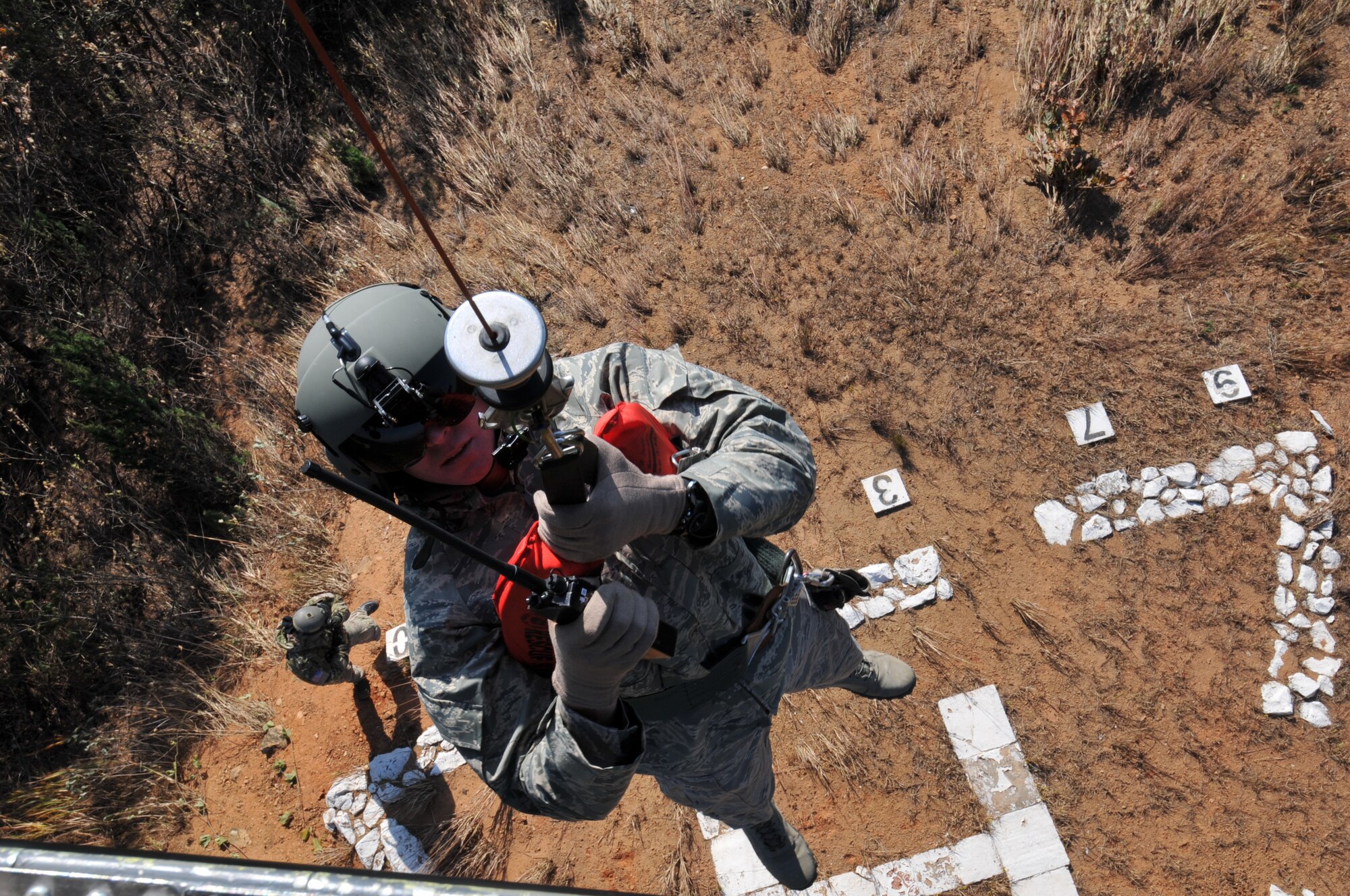 U.S. Air Force Tech. Sgt. Heath Culbertson, 33rd Rescue Squadron HH-60G Flight Engineer, from Kadena Air Base, Japan is hoisted up to the helicopter during exercise PACIFIC THUNDER Nov. 1, 2011 near Osan Air Base, Korea.

PACIFIC THUNDER is a 10-day exercise, from Oct. 31-Nov. 09, at Osan AB, Korea involving the 33rd Rescue Squadron, Kadena AB, Japan, and the 25th Fighter Squadron, Osan AB, Korea. These units work together to practice Combat Search and Rescue tactics to prepare for real-world emergency situations. 
(U.S. Air Force photo/Tech. Sgt. Angelique Bilog/released)
