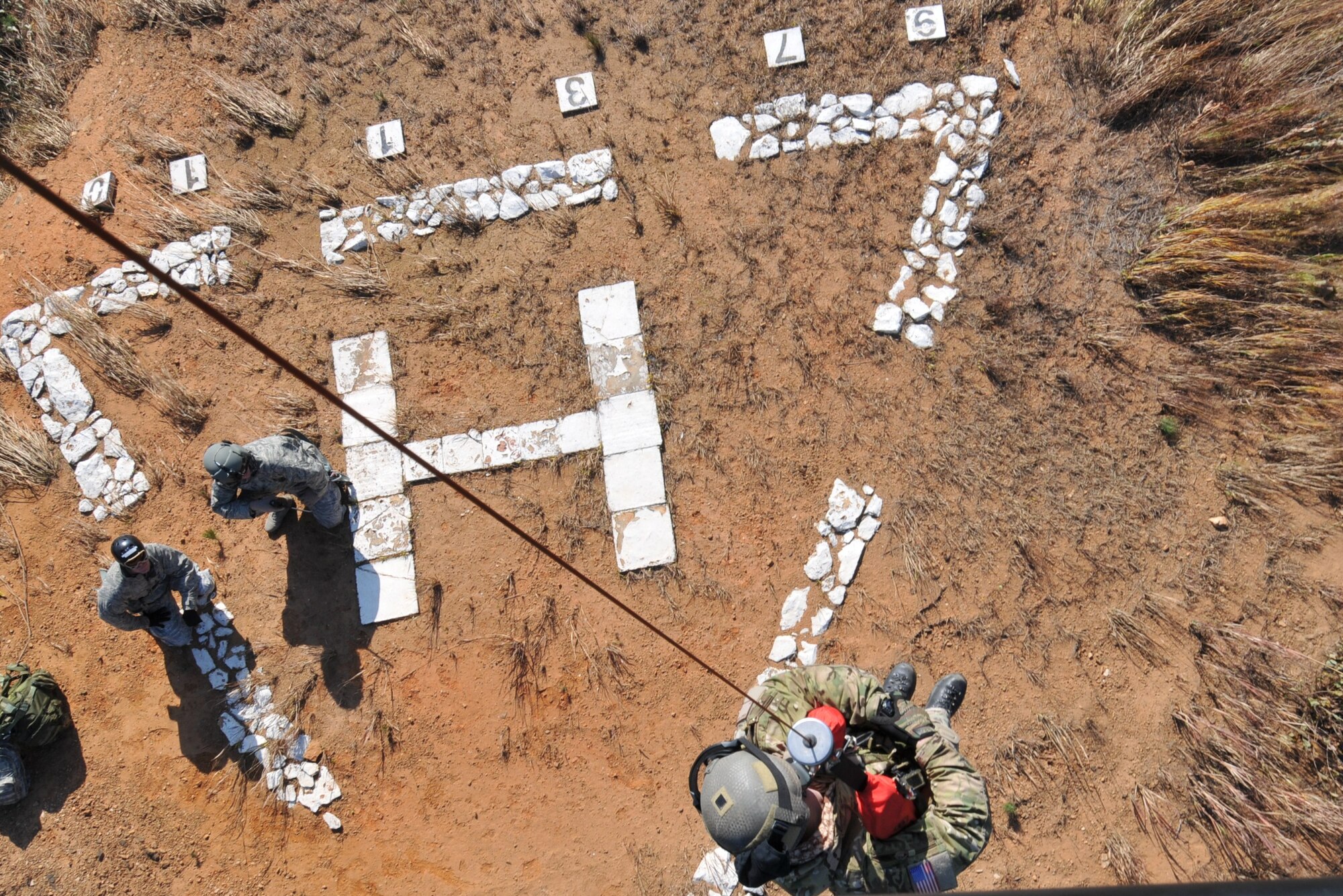 U.S. Air Force Staff Sgt. Robert Colliton, Survival Evasion Resistance Escape Specialist at the 18th Operation Support Squadron, Kadena Air Base, Japan, is hoisted from the helicopter to the ground during exercise PACIFIC THUNDER Nov. 1, 2011 near Osan Air Base, Korea.

PACIFIC THUNDER is a 10-day exercise, from Oct. 31-Nov. 09, at Osan AB, Korea involving the 33rd Rescue Squadron, Kadena AB, Japan, and the 25th Fighter Squadron, Osan AB, Korea. These units work together to practice Combat Search and Rescue tactics to prepare for real-world emergency situations. 
(U.S. Air Force photo/Tech. Sgt. Angelique Bilog/released)
