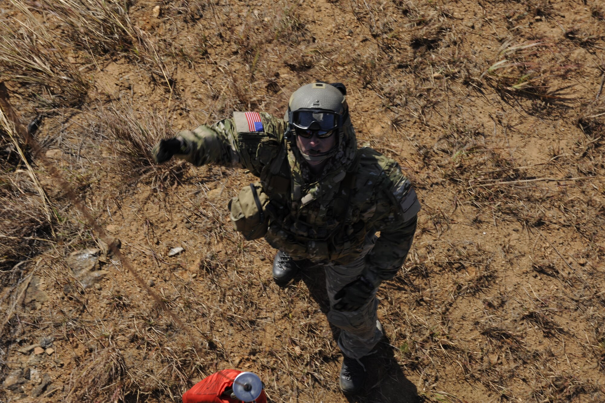 U.S. Air Force Staff Sgt. Robert Colliton, Survival Evasion Resistance Escape Specialist at the 18th Operation Support Squadron, Kadena Air Base, Japan, gives the okay to hoist signal to the helicopter during exercise PACIFIC THUNDER Nov. 1, 2011 near Osan Air Base, Korea.

PACIFIC THUNDER is a 10-day exercise, from Oct. 31-Nov. 09, at Osan AB, Korea involving the 33rd Rescue Squadron, Kadena AB, Japan, and the 25th Fighter Squadron, Osan AB, Korea. These units work together to practice Combat Search and Rescue tactics to prepare for real-world emergency situations. 
(U.S. Air Force photo/Tech. Sgt. Angelique Bilog/released)

