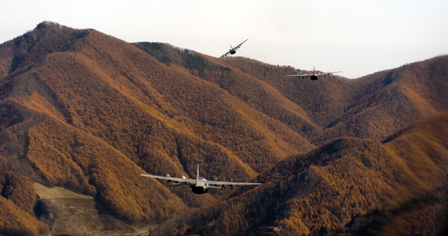 OVER JAPAN -- Three C-130 Hercules fly in a formation during a Samurai Surge over Japan, Nov. 2, 2011. Aircraft from Yokota Air Base practiced flying in formation and airdrop skills. (U.S. Air Force photo/Airman 1st Class Krystal M. Garrett)