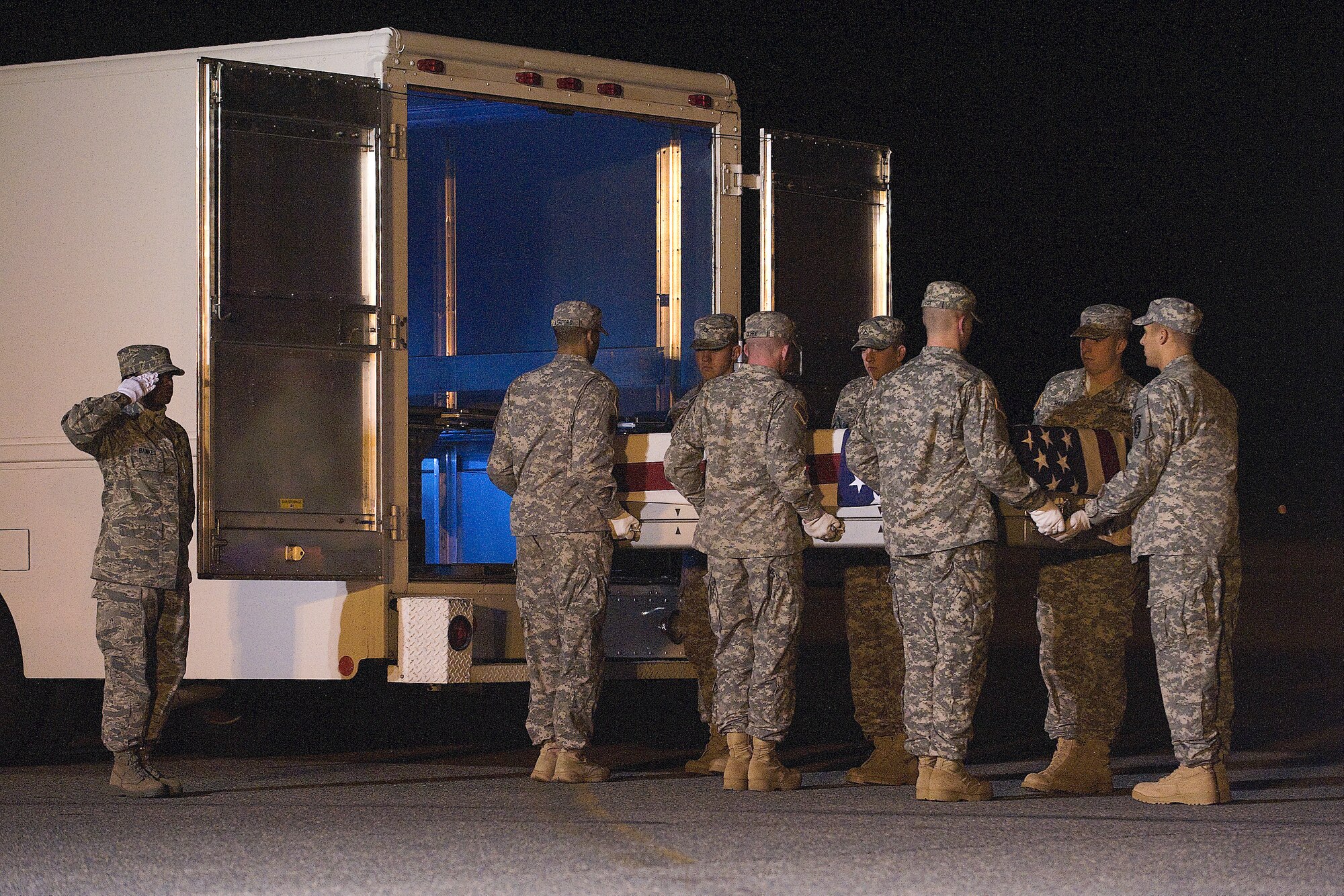 A U.S. Army carry team transfers the remains of Army Spc. Sarina N. Butcher, of Checotah, Okla., at Dover Air Force Base, Del., Nov. 3, 2011. Butcher was assigned to the 700th Brigade Support Battalion, 45th Infantry Brigade Combat Team, Oklahoma National Guard, Tulsa Okla. (U.S. Air Force photo/Steve Kotecki)
