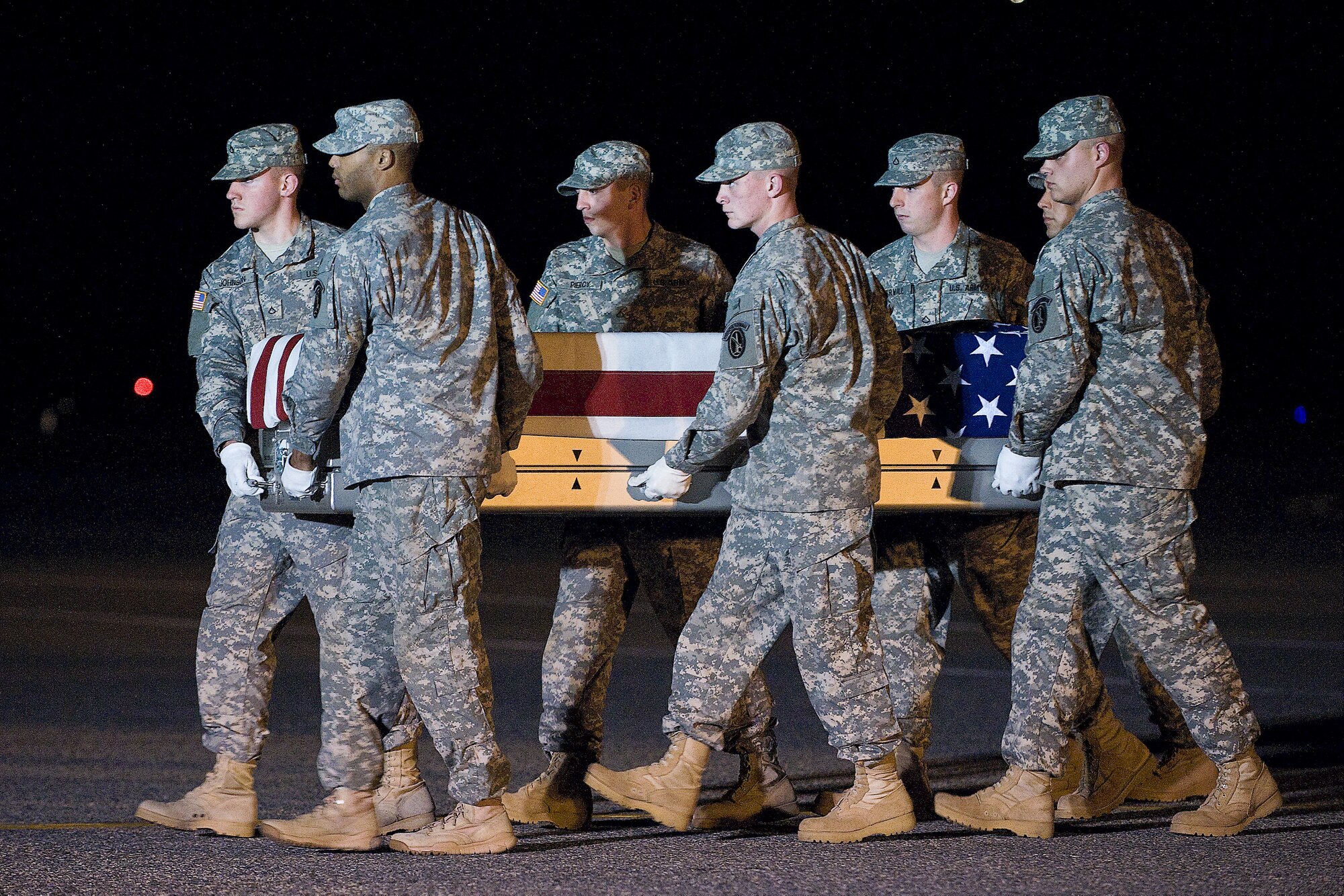 A U.S. Army carry team transfers the remains of Army Sgt. Christopher D. Gailey, of Ochelata, Okla., at Dover Air Force Base, Del., Nov. 3, 2011. Gailey  was assigned to the 700th Brigade Support Battalion, 45th Infantry Brigade Combat Team, Oklahoma National Guard, Tulsa Okla. (U.S. Air Force photo/Steve Kotecki)
