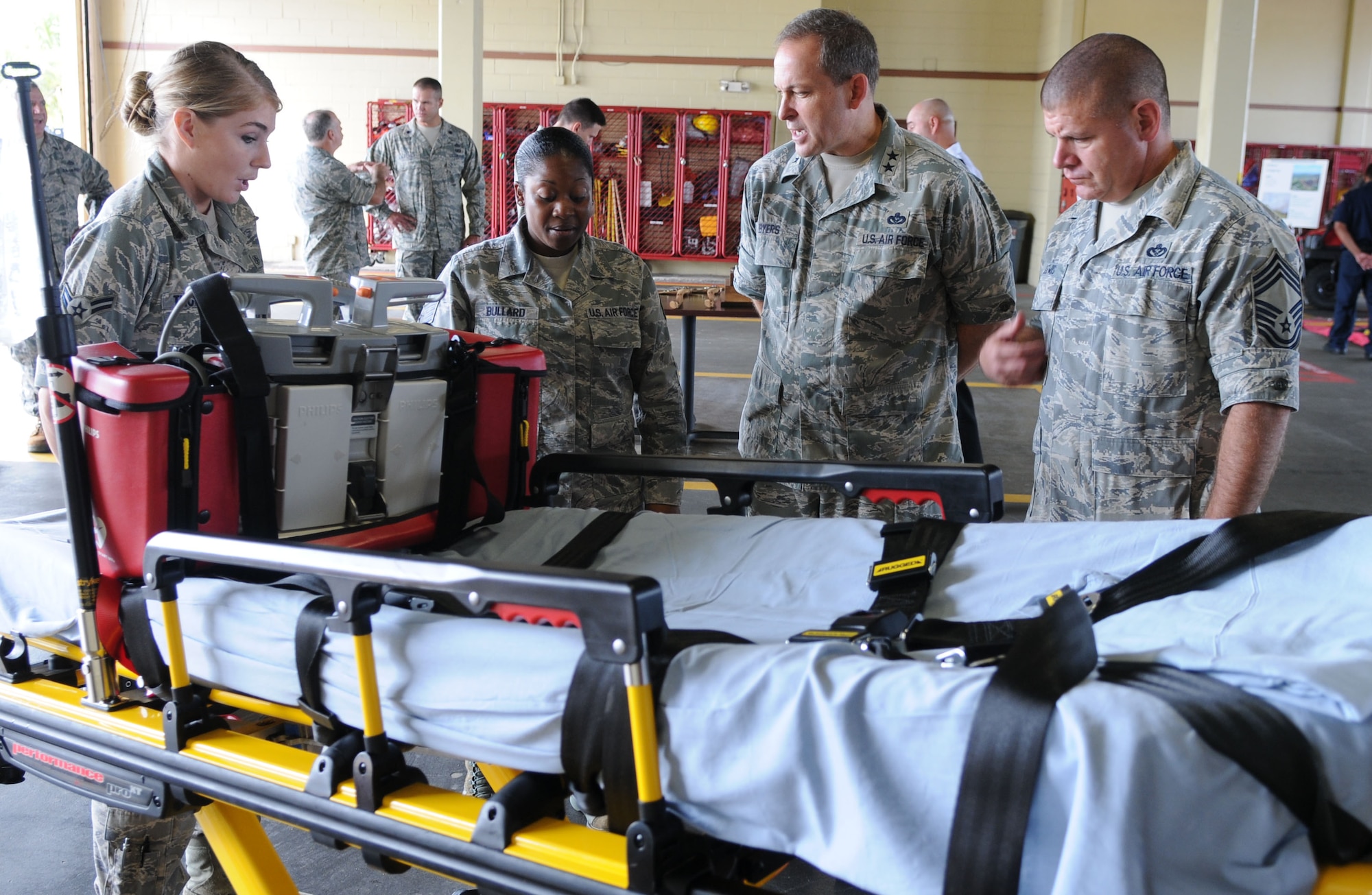 ANDERSEN AIR FORCE BASE, Guam – Major Gen. Timothy Byers (right center), Air Force Civil Engineer, Headquarters U.S. Air Force, is briefed by Airman 1st Class Kendall Thompson and Staff Sgt. Sharnta Bullard, 36th Medical Operations Squadron medical technicians, on ambulance services here, Oct. 29. General Byers visited with members of the 36th Civil Engineer Squadron for  briefings on water rescue, wildland fires and cliff rescues. (U.S. Air Force photo/ Senior Airman Carlin Leslie)