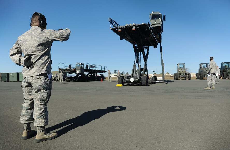 615th Contingency Response Wing Airmen practice next generation small loader high-reach operations during the staff assistance visit. (U.S. Air Force photo/ Master Sgt. Stan Parker)