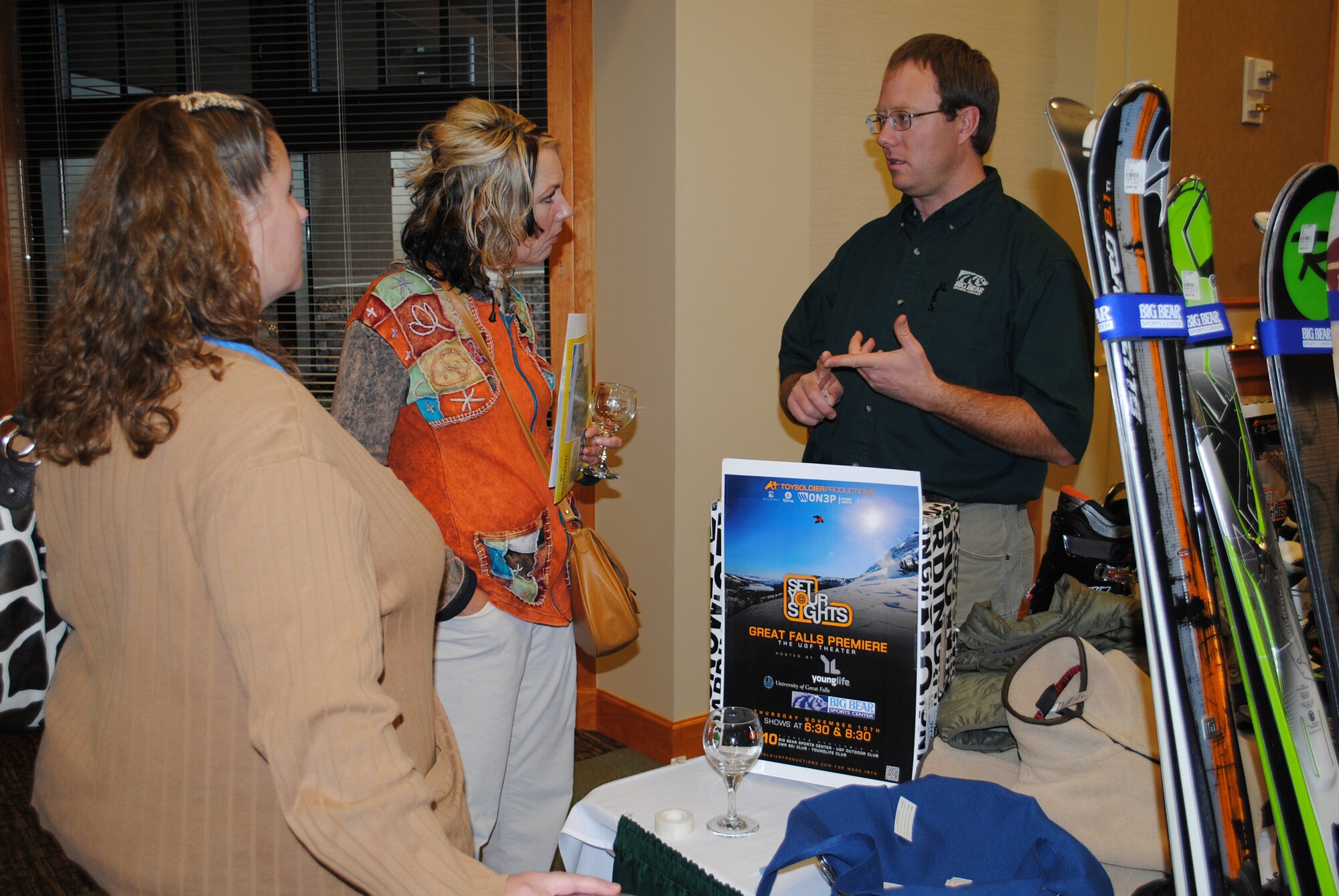 From left, Team Malmstrom spouses Melissa Frank and Holly Garcia talk with Justin Okes, a representative from Big Bear Sports Center, at the Ski and Wine Fest Oct. 27. (U.S. Air Force photo/Airman Corntey Paxton)
