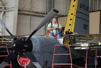 Quincy Smith wires a C-130 engine. A total of 20 aircraft were delivered on time in October, including six C-130s. U. S. Air Force file photo by Sue Sapp
