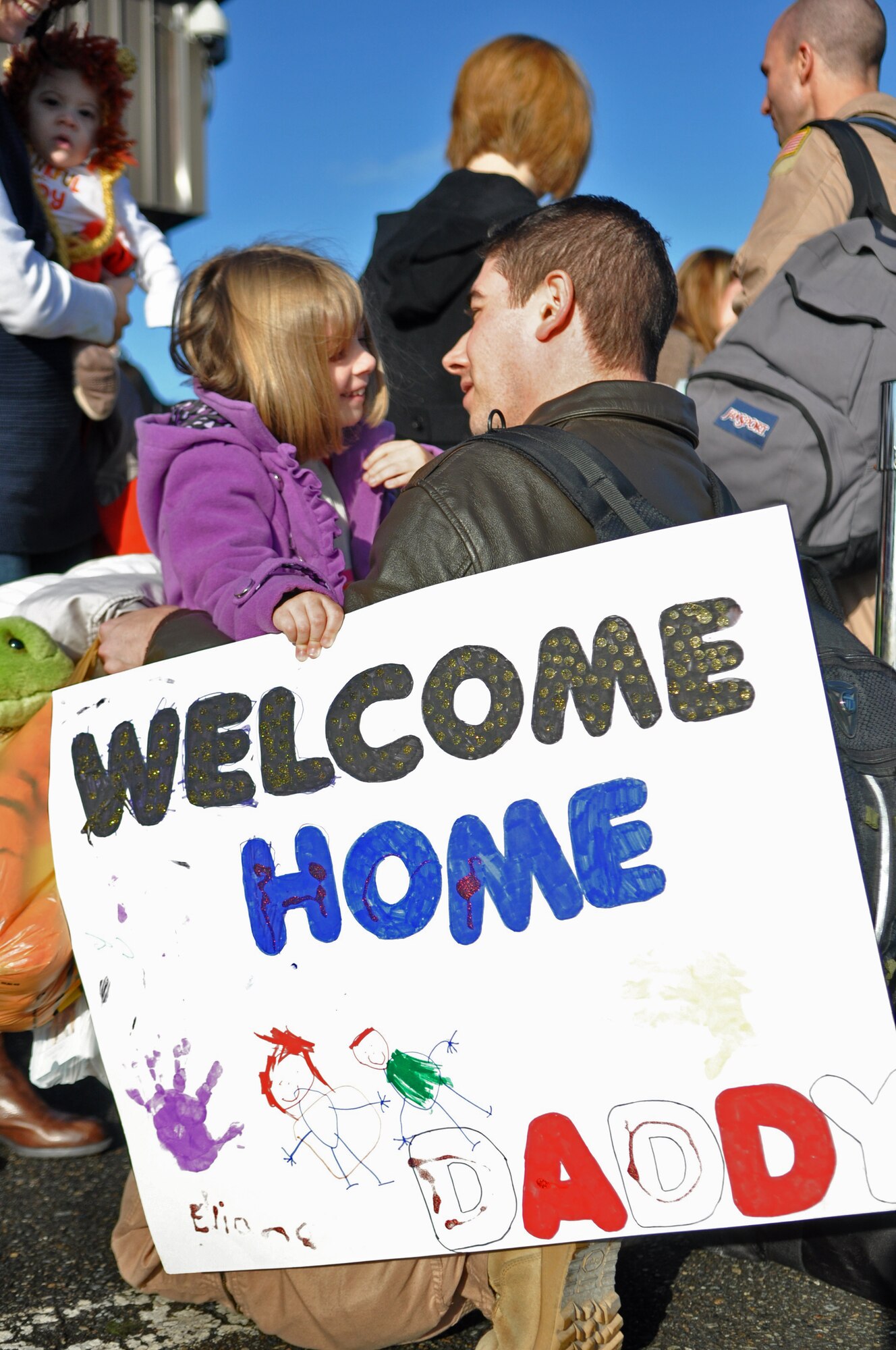Capt. Evan Nickel, 8th Airlift Squadron pilot, greets his daughter, Eliana, after returning from a 67-day deployment in support of Operation Enduring Freedom, New Dawn and Combined Joint Task Force-Horn of Africa Nov. 3, 2011, at Joint Base Lewis-McChord, Wash. (U.S. Air Force photo/Airman 1st Class Leah Young)