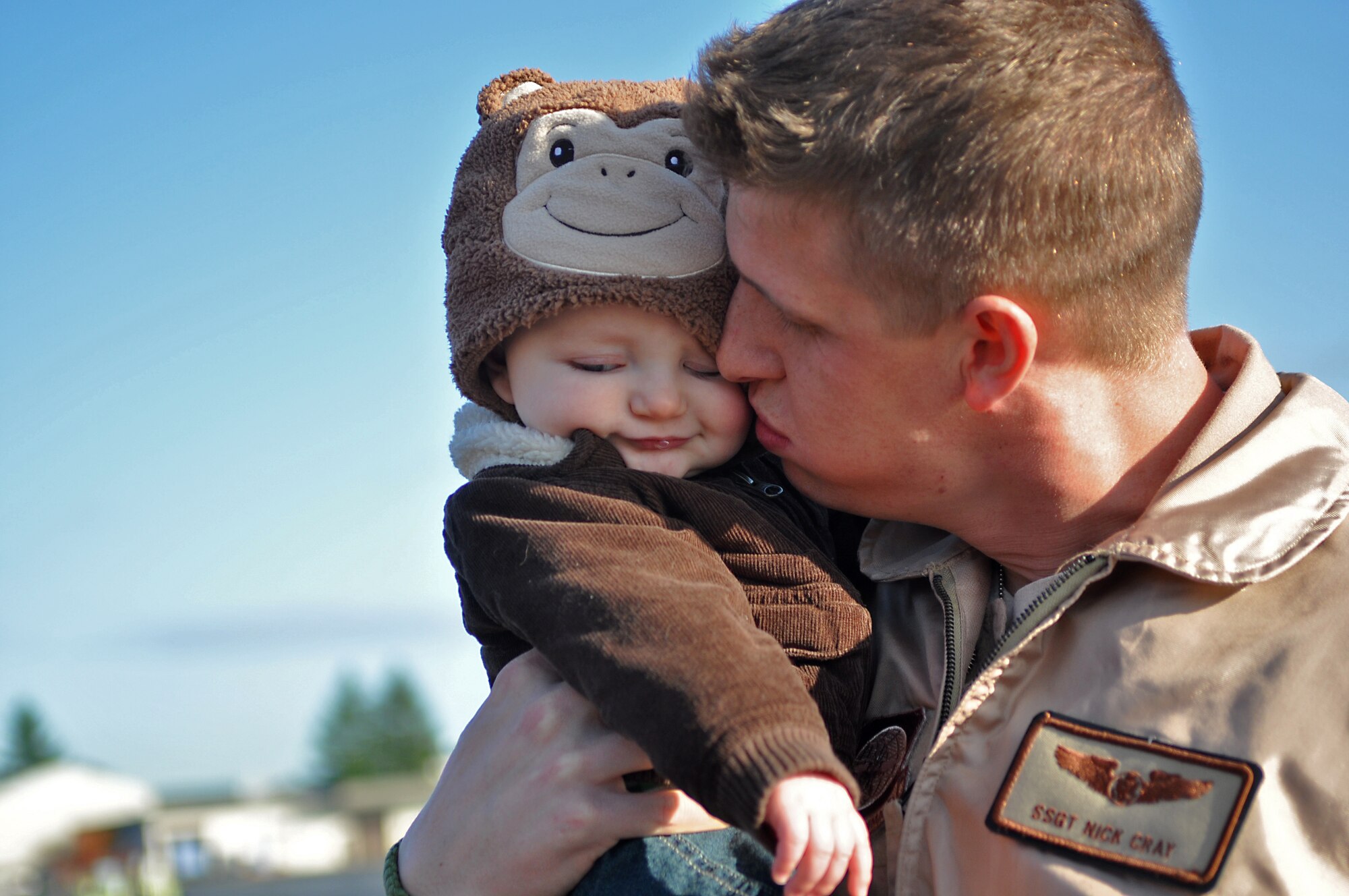 Staff Sgt. Nick Cray, 8th Airlift Squadron loadmaster, greets his son after returning from a 67-day deployment in support of Operation Enduring Freedom, New Dawn and Combined Joint Task Force-Horn of Africa Nov. 3, 2011, at Joint Base Lewis-McChord, Wash. (U.S. Air Force photo/Airman 1st Class Leah Young)
