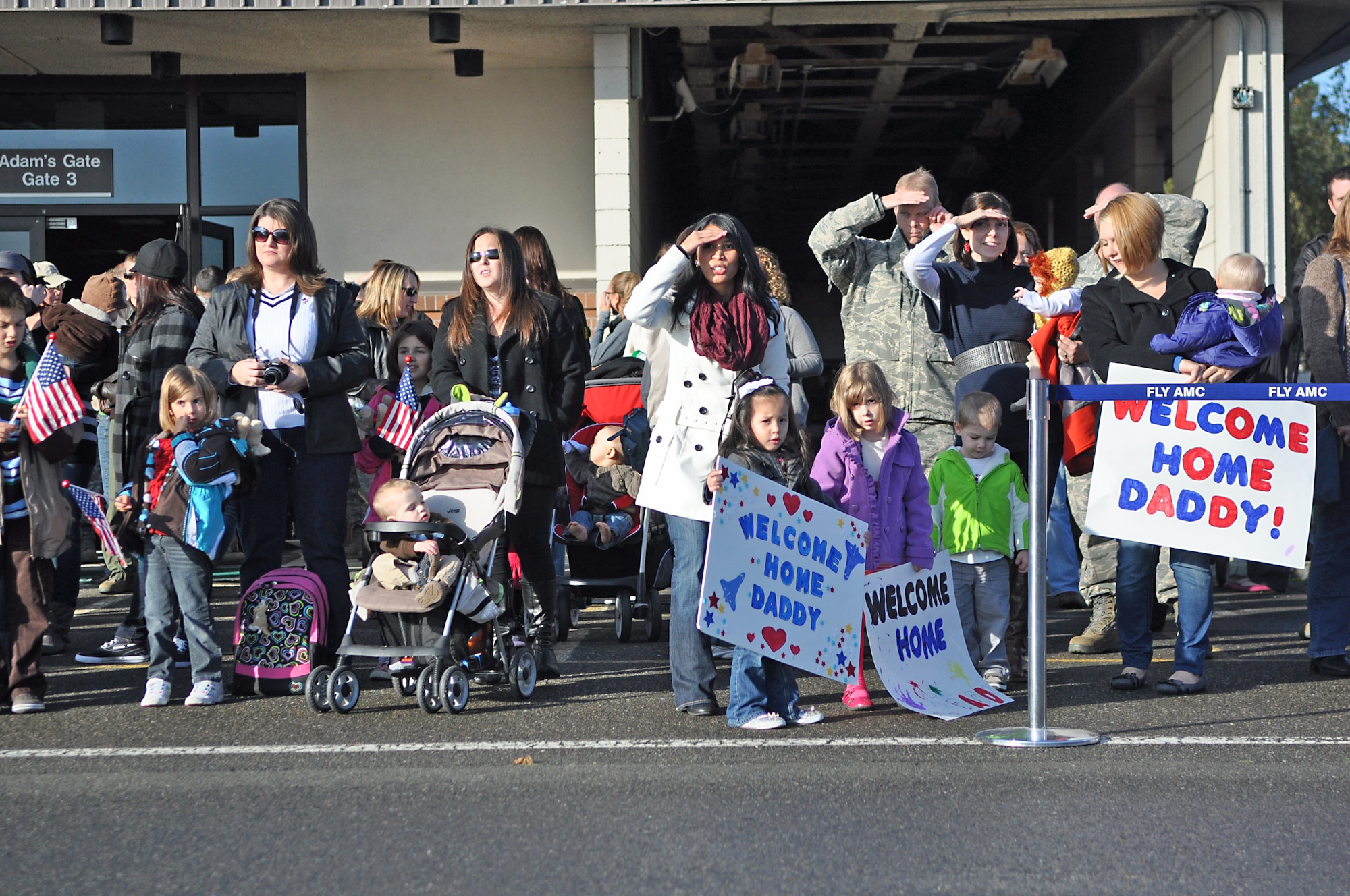 Family and friends wait at the McChord Field Passenger Terminal for Airmen of the 8th Airlift Squadron to return from a 67-day deployment Nov. 3, 2011, at Joint Base Lewis-McChord, Wash. Members of the 8th AS were replaced by the 4th AS, which departed for the Middle East Oct. 26 and are expected to return in January. (U.S. Air Force photo/Airman 1st Class Leah Young)