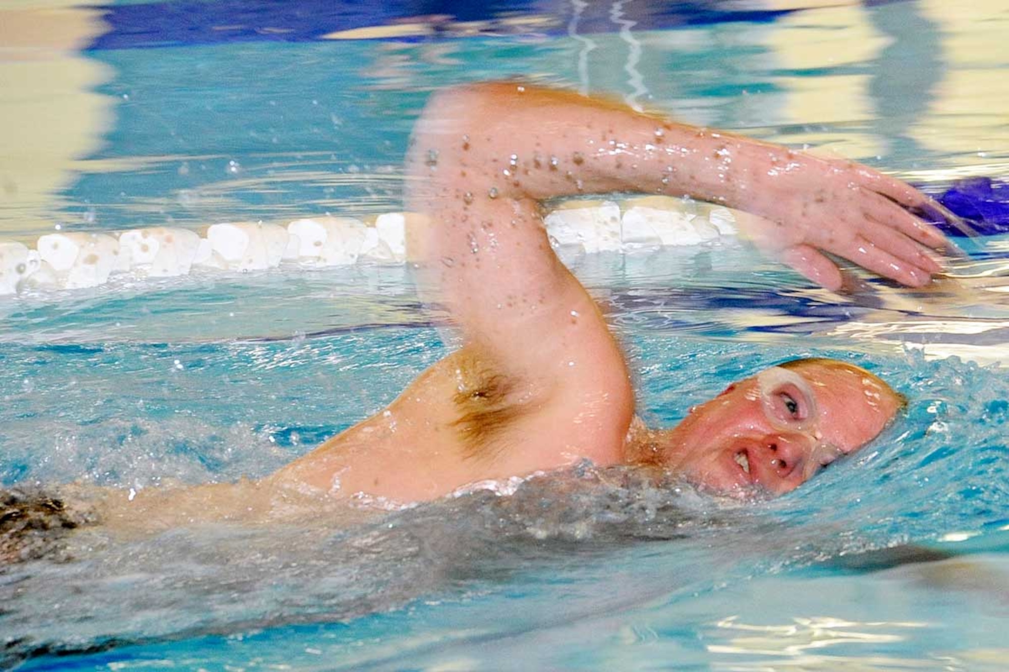 John Lerch, swimming for the 673d FSS team, competes in the grueling 500-yard freestyle. Lerch finished second in the event with a time of 7:58. (U.S. Air Force photo/John Pennell)