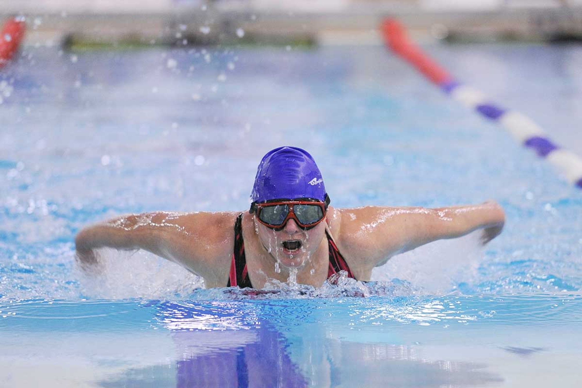 Lynette Lerch swims the women’s 50-yard fly during the Joint Base Elmendorf-Richardson swim meet at the Buckner Physical Fitness Center pool Oct. 27. Lerch, swimming for the 673d Force Support Squadron team, was the only competitor in the event and finished with a time of 54.14 seconds. (U.S. Air Force photo/John Pennell)