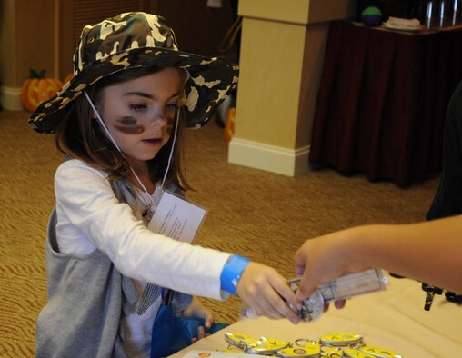 An Air Force Reserve-dependent child goes through a mock deployment line during Air Force Reserve Command’s South Region Yellow Ribbon Program in Charlotte, N.C., Oct. 30, 2011. Reserve-dependent children were given a chance to interact with one another and learn about the pre-deployment process through YRP’s youth program. (U.S. Air Force photo/Staff Sgt. Anna-Marie Wyant)