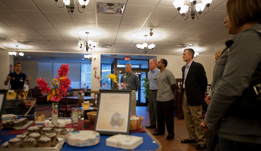 U.S. Air Force Col. Mark Ruse, 23rd Mission Support Group commander, far left, gives a general overview of the dining facility and all the services it provides to an Air Combat Command Hennessy inspection team during an ice breaker event at Moody Air Force Base, Ga., Oct. 30, 2011. The 23rd Force Support Squadron services flight held the ice breaker to welcome the team and introduce all the members involved with the Georgia Pines Dining Facility and Flight Kitchen. (U.S. Air Force photo by Airman 1st Class Nicholas Benroth/Released)