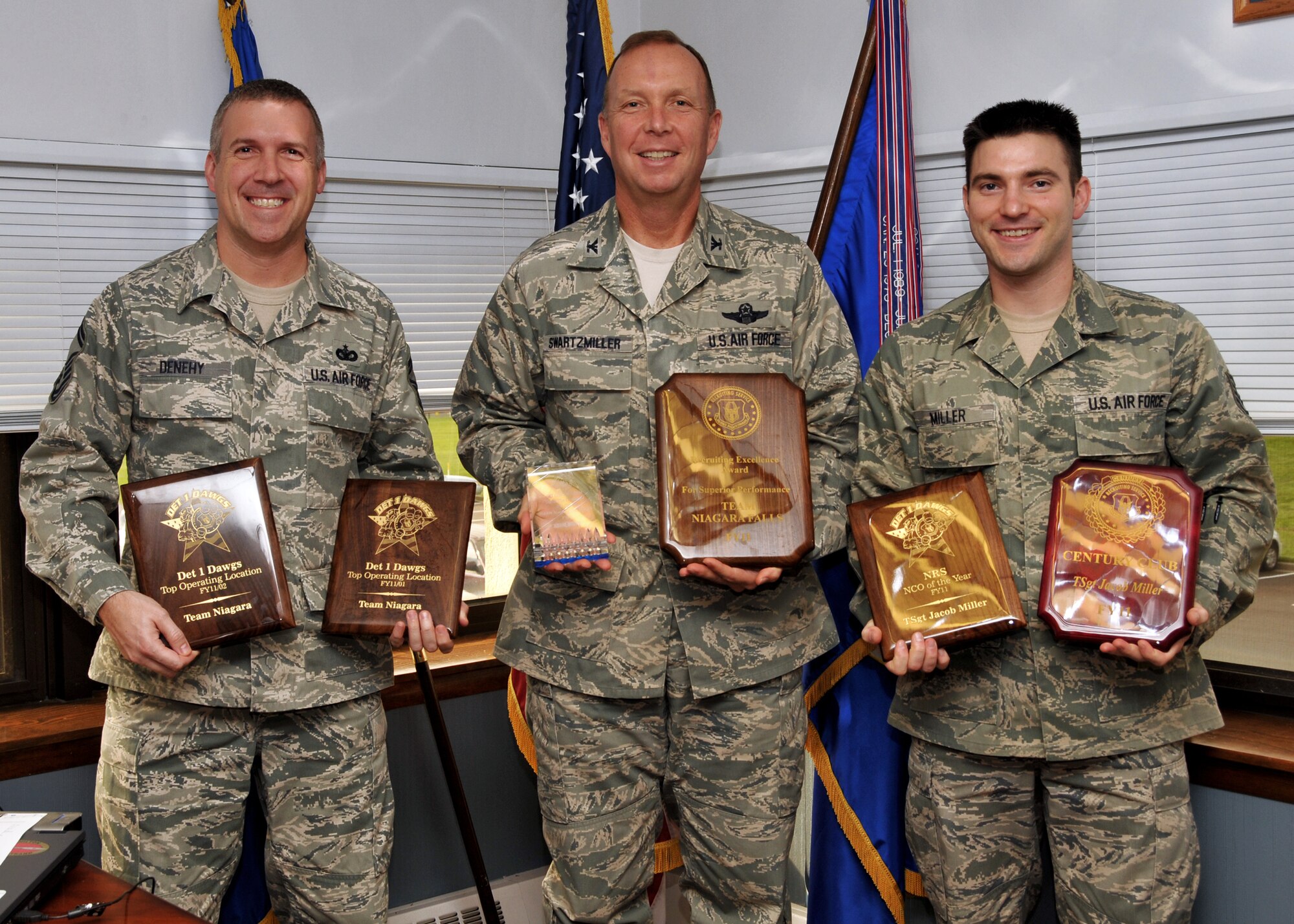 914th Airlift Wing Commander Col. Allan Swartzmiller (center) poses with Air Force Reserve Recruiters Senior Master Sgt. Robert Denehy and Tech. Sgt. Jacob Miller, November 1, 2011 Niagara Falls Air Reserve Station, NY. The recruiting office was recognized for winning multiple awards at their Annual Training Workshop. (U.S. Air Force photo by Staff Sgt. Joseph McKee)