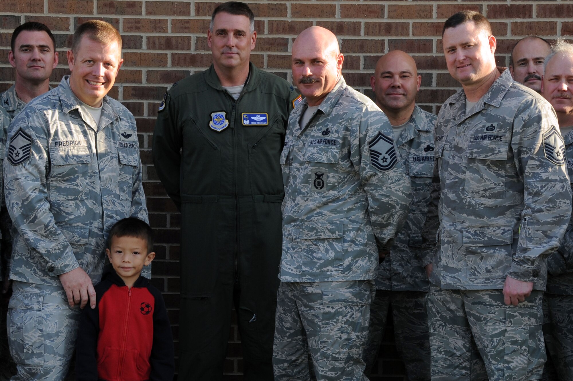 Col. Mike Minihan, 19th Airlift Wing commander, and the chiefs of Little Rock Air Force Base, Ark., congratulate Senior Master Sgt. Samuel Fredrick, 61st Airlift Squadron loadmaster superintendent, Senior Master Sgt. Curtis Crigger, 19th Security Forces Squadron logistics superintendent, Senior Master Sgt. Joseph Vinsant, 19th Force Support Squadron chief of manpower and organization, for their promotion to chief master sergeant 2, 2011. Chief master sergeant is the most prestigious enlisted rank in the Air Force, with only one percent of the enlisted force privileged to wear it. (U.S. Air Force photo by Airman 1st Class Kaylee Clark)