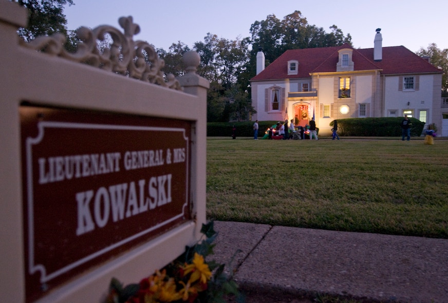 Costumed children receive candy from Lt. Gen. James Kowalski, Air Force Global Strike Command commander, and his wife, Julie, Halloween night on Barksdale Air Force Base, La. Families were allowed to trick or treat from 6 p.m. until 8 p.m. in the housing areas on main-base as well as on the East-side of base. (U.S. Air Force photo/Senior Airman Chad Warren)(RELEASED)