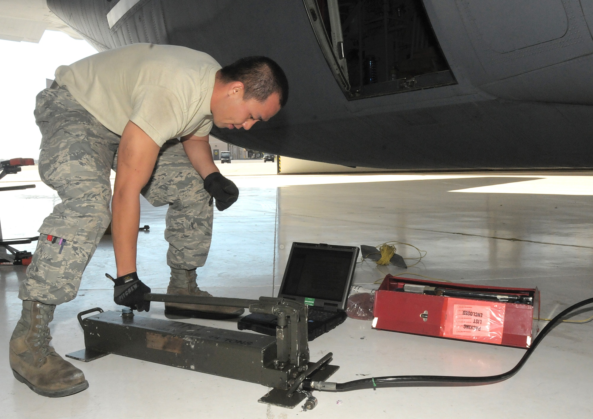 Airman 1st Class Joseph Ray A. Perez assists with changing a tire on a C130-J during a maintenance training exercise with other members of the 146th Aerospace Maintenance Squadron at the 146th Airlift Wing Port Hueneme, Calif. on October 2, 2011. Airman 1st Class Perez is the 146th Airlift Wing's Featured Airman of the Month for October, 2011.