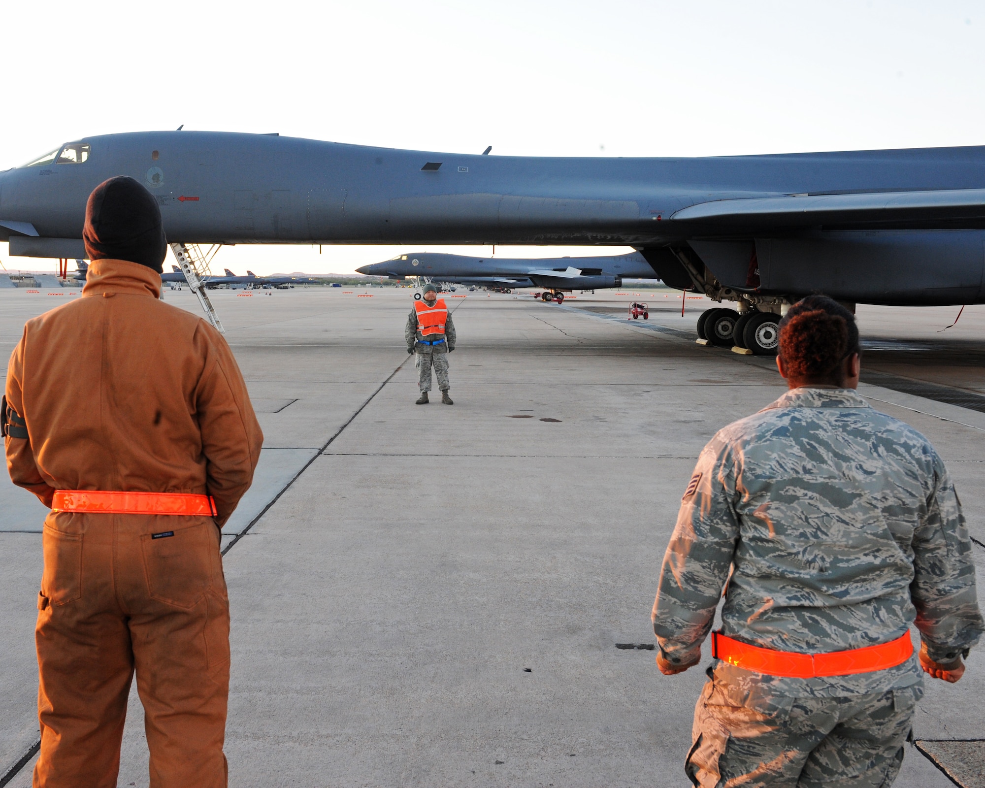 Staff Sgt. Ted Moreno, 7th Aircraft Maintenance Squadron, leads airmen through a Foreign Object Debris walk Nov. 3, 2011, at Dyess Air Force Base, Texas. Examples of FOD are aircraft parts, rocks, broken pavement, ramp equipment, tools, bolts and vehicle parts. (U.S. Air Force photo by Airman 1st Class Peter Thompson/Released)
