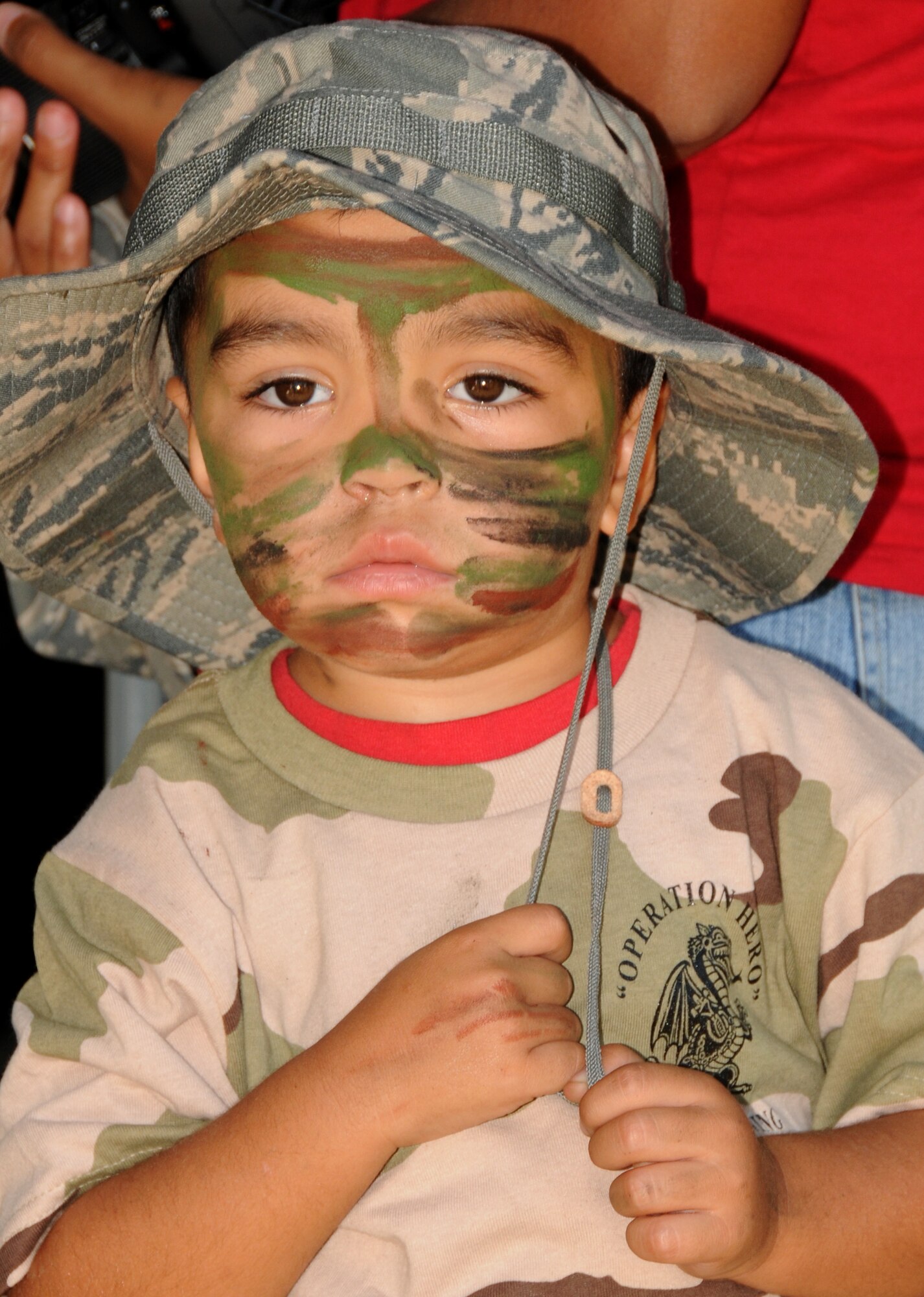 Wesley Wilkerson, Jr., 3, wears an Air Force hat used in deployments during Operation Hero Oct. 15, 2011, Keesler Air Force Base, Miss.  Wesley is the son of Staff Sgt. Wesley and Dania Wilkerson, 81st Medical Operations Squadron.  Operation Hero is presented twice a year to give parents a chance to expose their children to what happens when they leave home for deployment tasking or temporary duty.   (U.S. Air Force photo by Kemberly Groue)