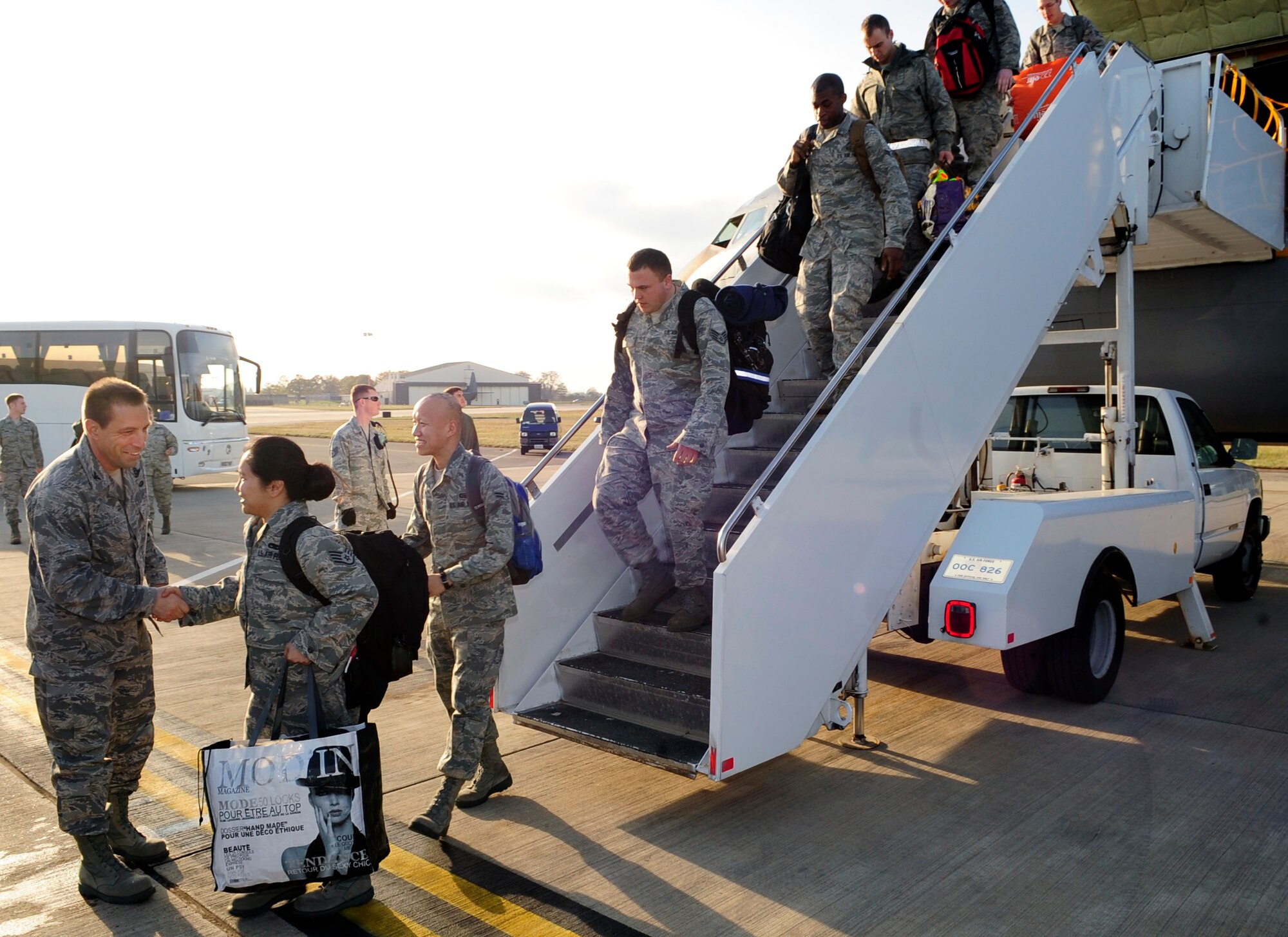 RAF MILDENHALL, England – Col. Christopher Kulas, 100th Air Refueling Wing commander, greets Airmen upon their return here Nov. 2, 2011, after being deployed to Istres, France, in support of Operations Odyssey Dawn and Unified Protector. A total of 40 Airmen from the 100th Operations Support squadron, 100th Aircraft Maintenance Squadron and the 100th Security Forces squadron returned from the deployment, all of whom had been there from one to six months. (U.S. Air Force photo/Senior Airman Ethan Morgan)