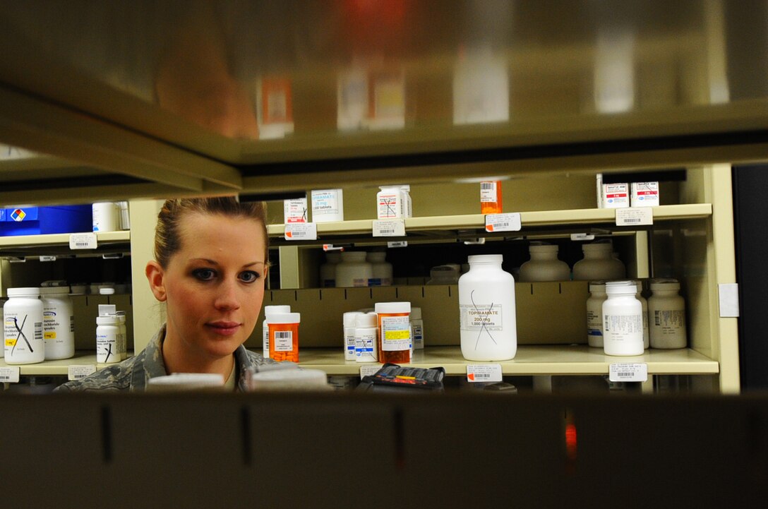 Staff Sgt. Amber Lloyd, 28th Medical Support Squadron medical logistics technician, scans medications at the pharmacy on Ellsworth Air Force Base, S.D., Oct. 25, 2011. Medical logistics technicians keep track of all of the pharmaceutical supplies to ensure that the pharmacy is stocked for their patients. (U.S. Air Force photo by Airman 1st Class Zachary Hada/Released)