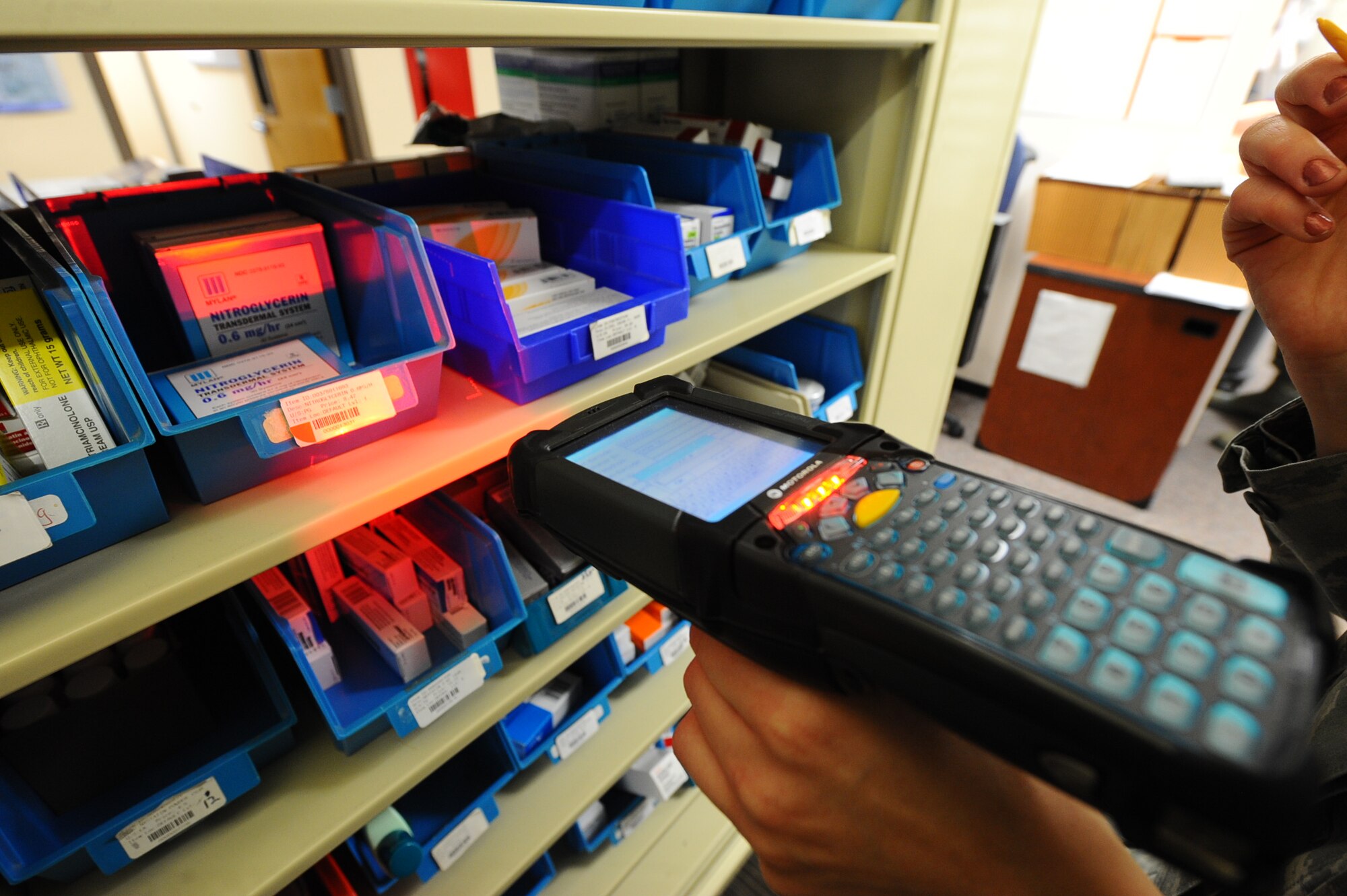 Staff Sgt. Amber Lloyd, 28th Medical Support Squadron medical logistics technician, scans pharmaceutical supplies with a personal handheld assistant scanner at the pharmacy on Ellsworth Air Force Base, S.D., Oct. 25, 2011. Items are inventoried and stocked to ensure supplies are available to patients. (U.S. Air Force photo by Airman 1st Class Zachary Hada/Released) 