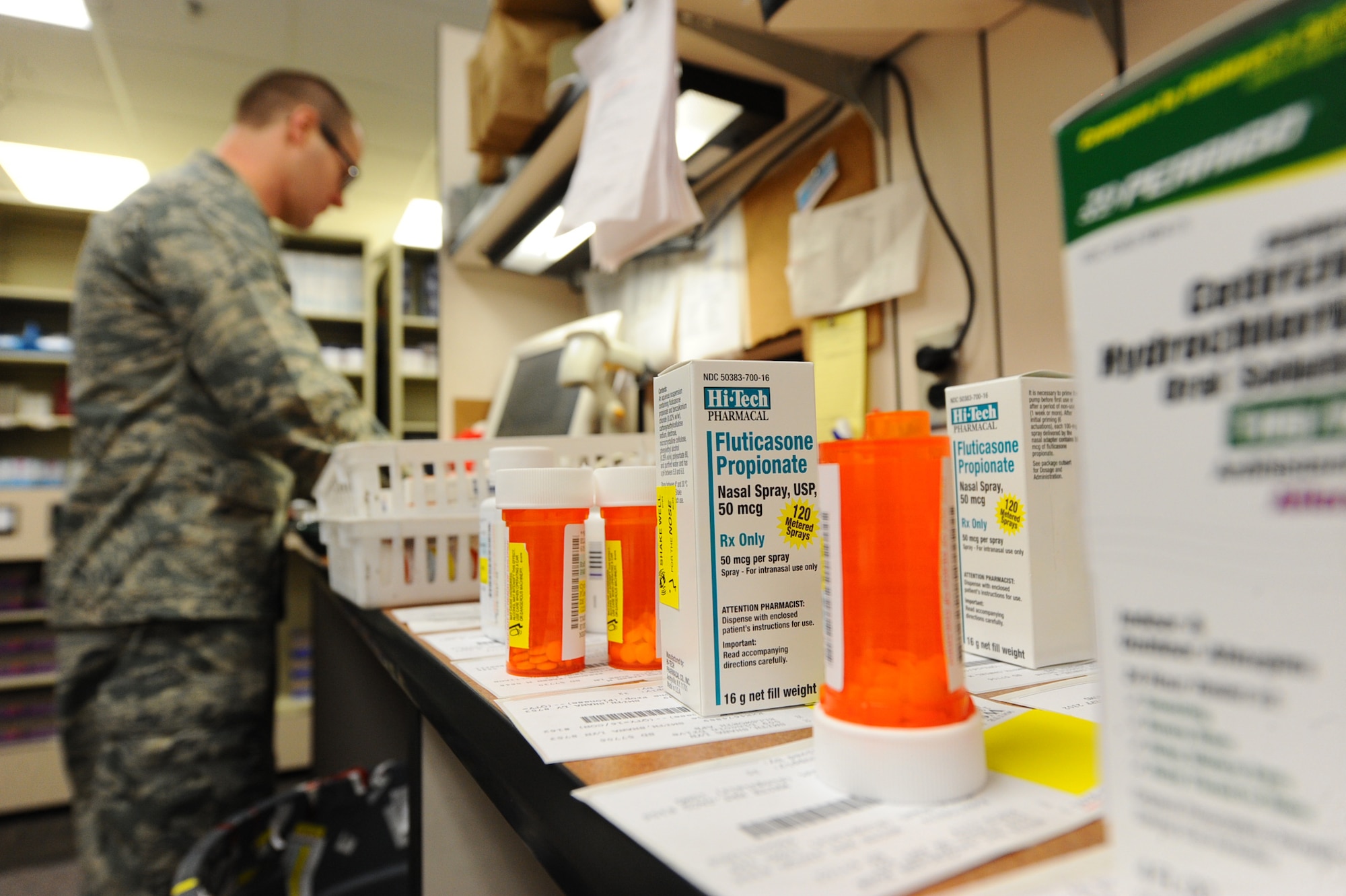 Capt. Richard Boyd, 28th Medical Support Squadron staff pharmacist, processes medications at the pharmacy on Ellsworth Air Force Base, S.D., Oct. 25, 2011. Boyd ensures patient’s safety by tracking their medications and the dosage levels. (U.S. Air Force photo by Airman 1st Class Zachary Hada/Released)