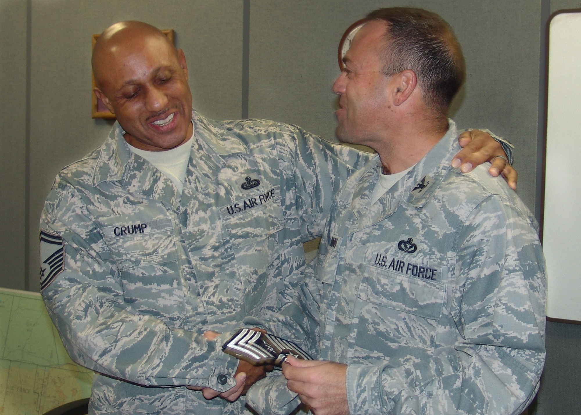 Senior Master Sgt. Gerard Crump, of the 96th Communications Squadron, celebrates with Col. Sal Nodjomian, the 96th Air Base Wing commander, upon finding out he was selected to the rank of chief master sergeant, Nov. 3 at Eglin Air Force Base, Fla.  (U.S. Air Force photo/Lois Walsh) 