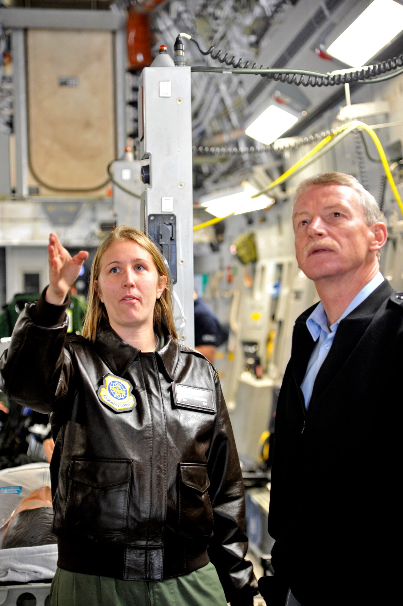 Senior Airman Megan Matthews, 6th Airlift Squadron C-17 loadmaster, explains the capabilities of the Globemaster to Air Vice Marshal Peter Stockwell, Chief of Royal New Zealand Air Force during a visit of Pacific Air Chiefs to Joint Base McGuire-Dix-Lakehurst, N.J. Oct. 26.  The Air Chiefs toured several Air Force bases during their weeklong trip to the U.S.  During their stop at JB MDL, the Air Chief's also witnessed convoy training procedures by the U.S. Air Force Expeditionary Center, C-17 capabilities demonstration by the 305th Air Mobility Wing and an aeromedical evacuation presentation by the 514th Air Mobility Wing.  (U.S. Air Force photo by Master Sgt. Laura K. Deckman)(released)